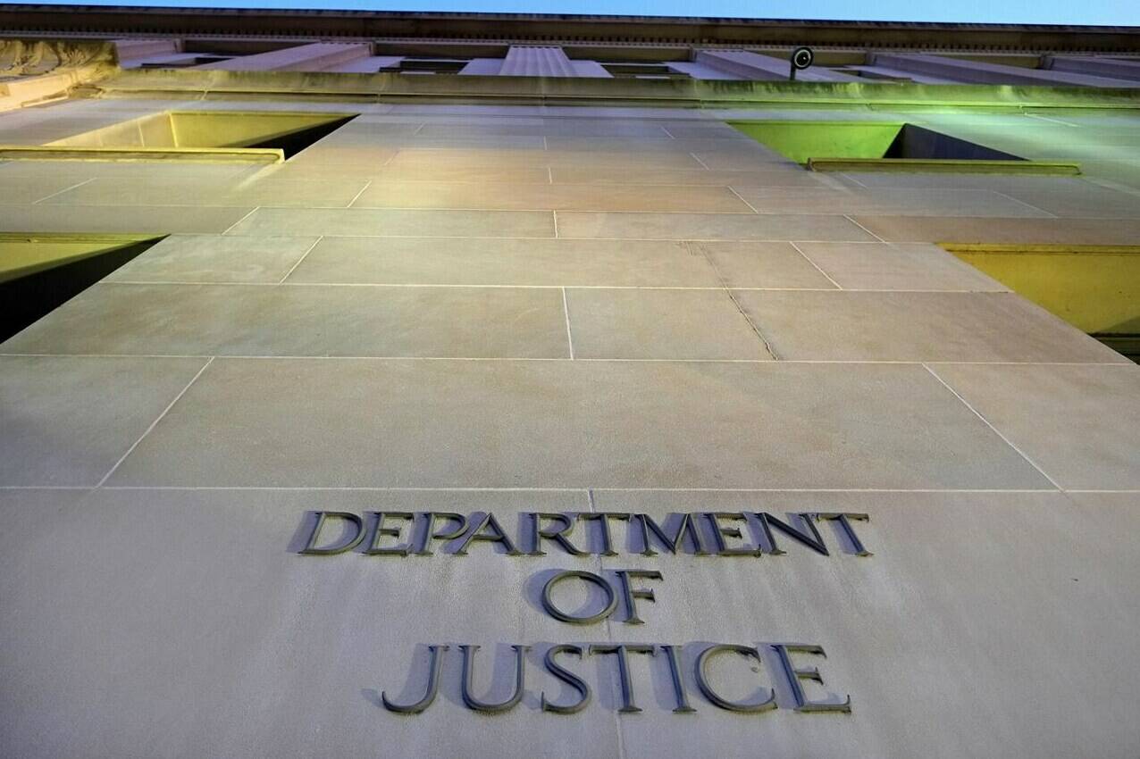 FILE - In this May 14, 2013, file photo, the Department of Justice headquarters building in Washington is photographed early in the morning. The Justice Department said Monday, Aug. 9, 2021, that it would work toward providing families of 9/11 victims with more information about the run-up to the attacks as part of a federal lawsuit that aims to hold the Saudi government accountable. (AP Photo/J. David Ake, File)