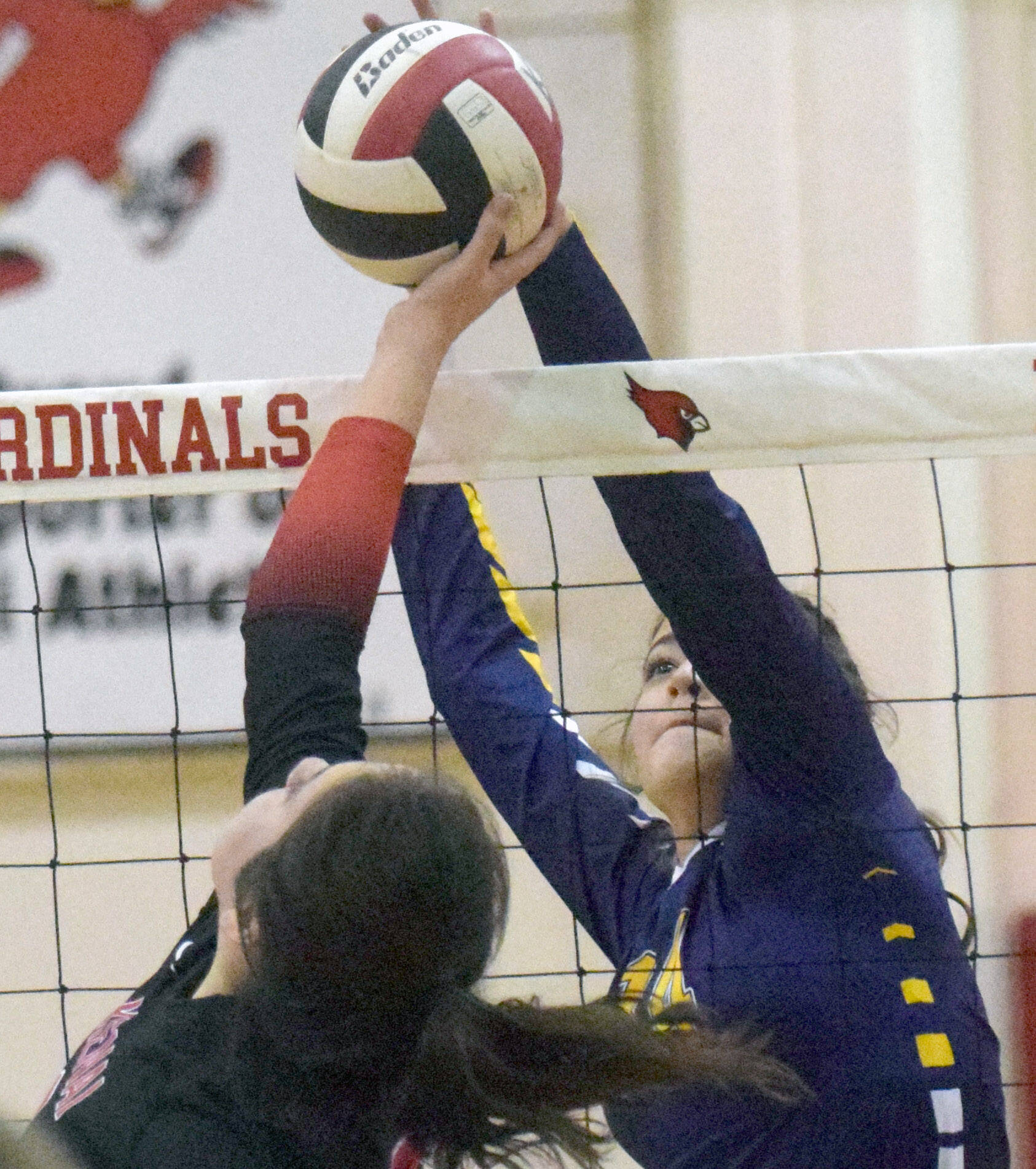 Kenai Central’s Brooke Ashley and Homer’s Nevaeh Diaz tangle at the net at Kenai Central High School on Thursday, Sept. 30, 2021, at Kenai Central High School. (Photo by Jeff Helminiak/Peninsula Clarion)