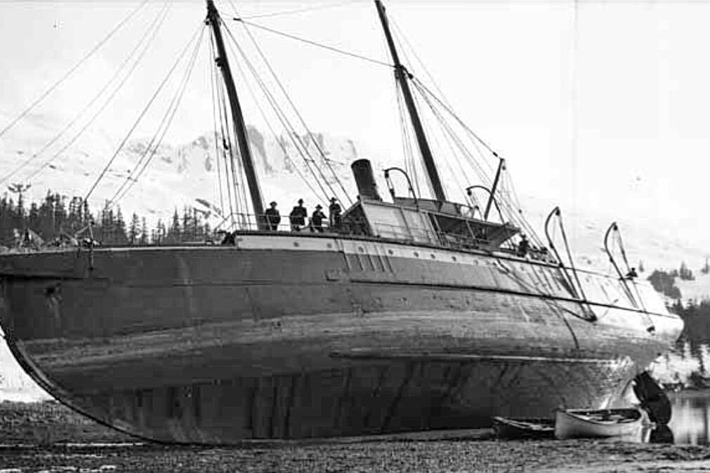 This undated John E. Thwaites photo, perhaps taken near Seward, shows the S.S. Dora grounded. (Alaska State Library photo collection)