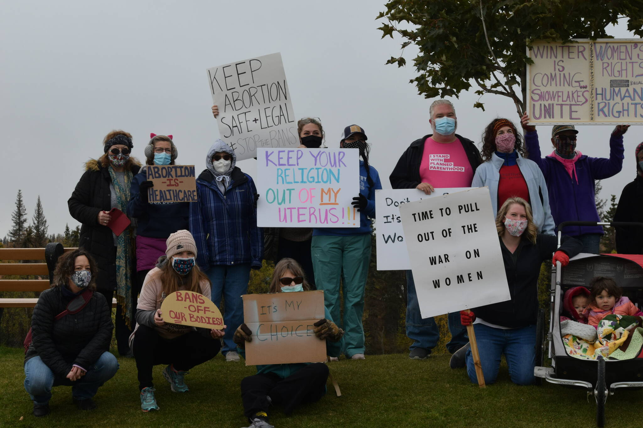 Demonstrators gather in Soldotna Creek Park as part of the national Women’s March “Rally for Abortion Justice” on Oct. 2, 2021. (Camille Botello/Peninsula Clarion)
