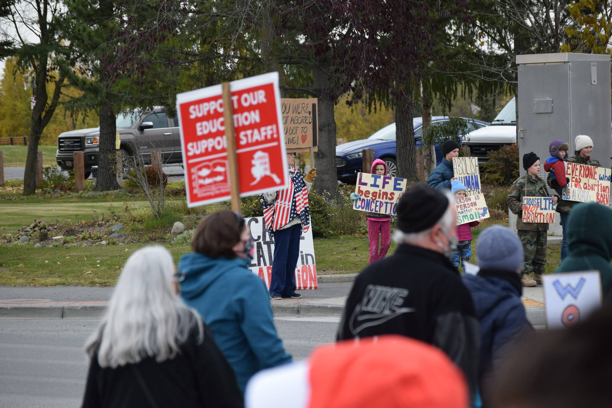 Anti-abortion counterprotestors gather in downtown Soldotna during the national Women’s March “Rally for Abortion Justice” on Saturday, Oct. 2, 2021. (Camille Botello/Peninsula Clarion)