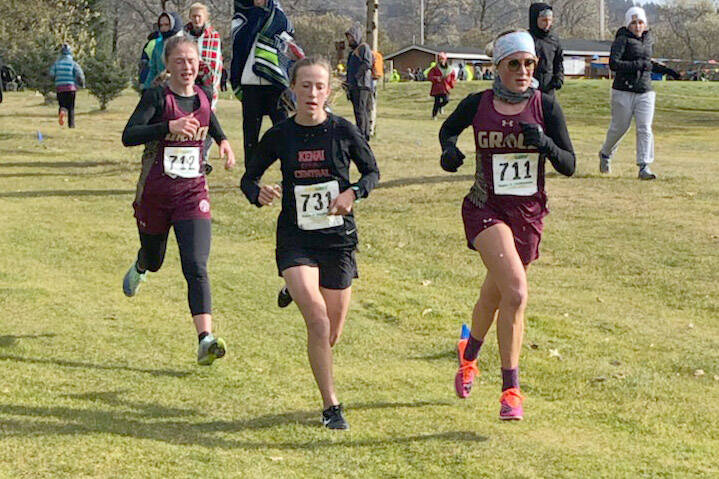 Kenai Central’s Jayna Boonstra races Kai Waythomas and Megan Nelson of Grace Christian on Saturday, Oct. 2, 2021, at the Region 3/Division II race in Kodiak, Alaska. (Photo courtesy of Todd Boonstra)