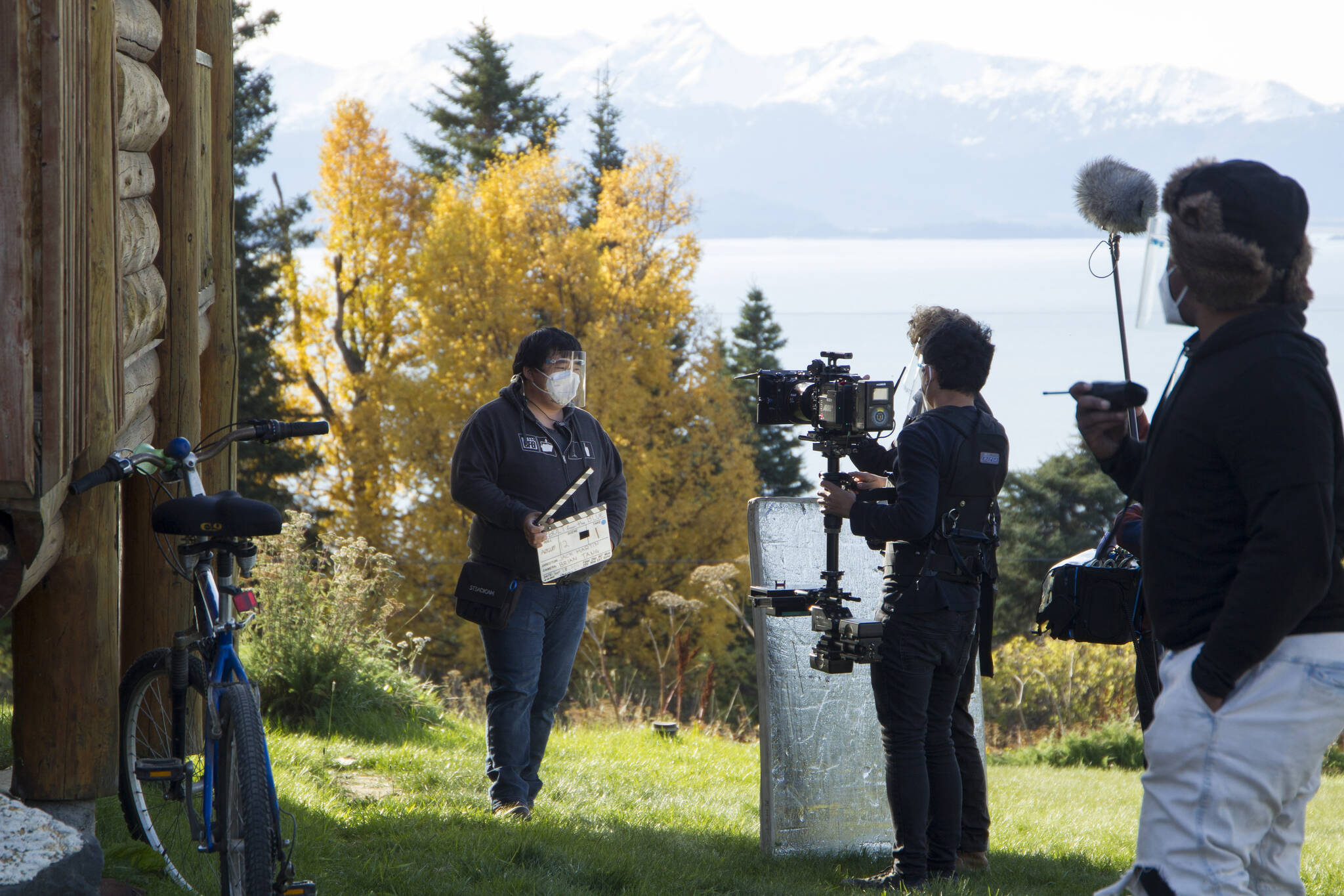 The Cosmic Hamlet Entertainment film crew prepares for a new scene to roll on the set of “Bolt from the Blue” at the Kilcher Homestead on Sept. 28. (Photo by Sarah Knapp/Homer News)