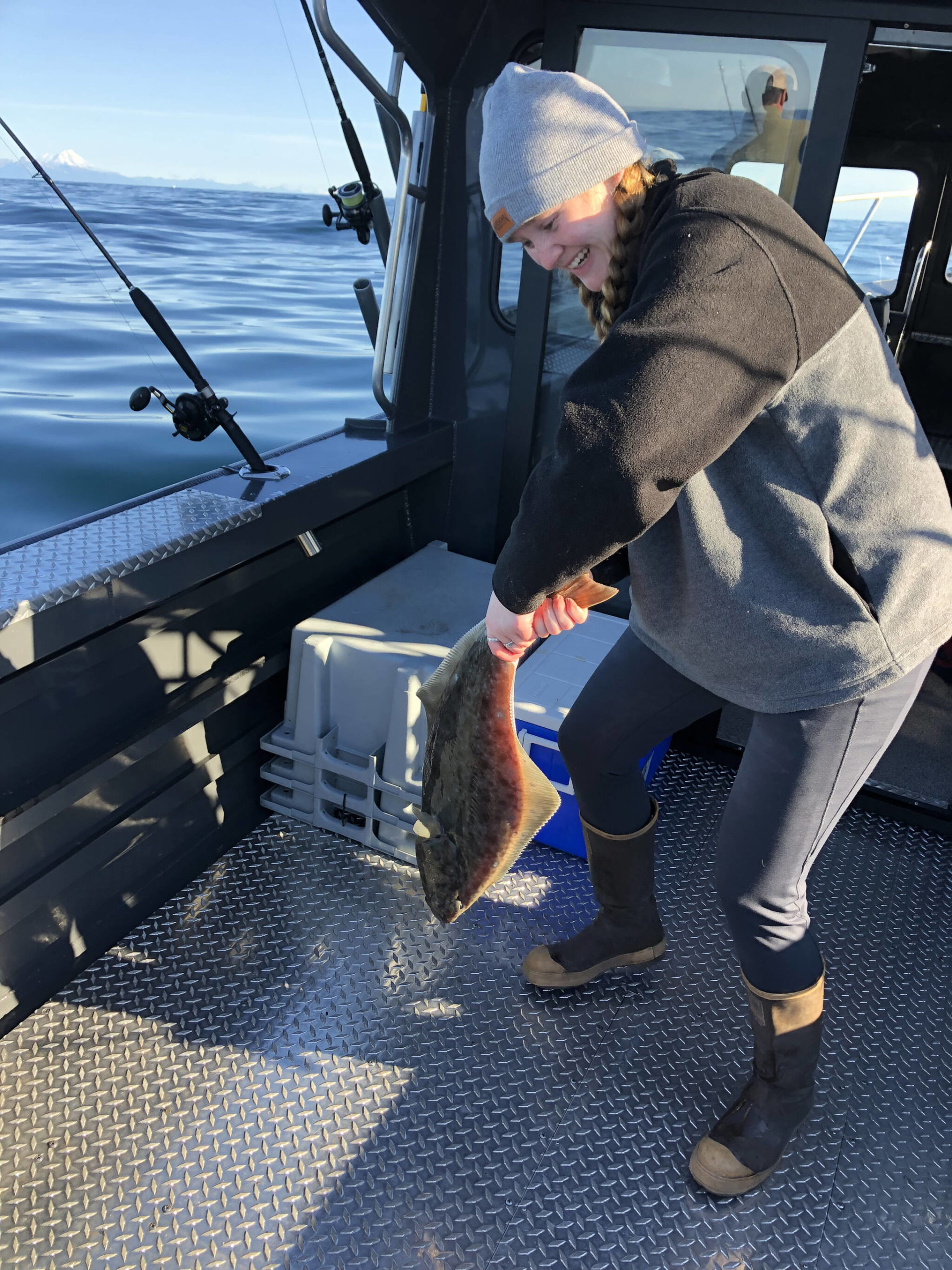 My halibut squirms after I reel it in off the coast of Homer, Alaska, on Sept. 6, 2021. (Photo provided)