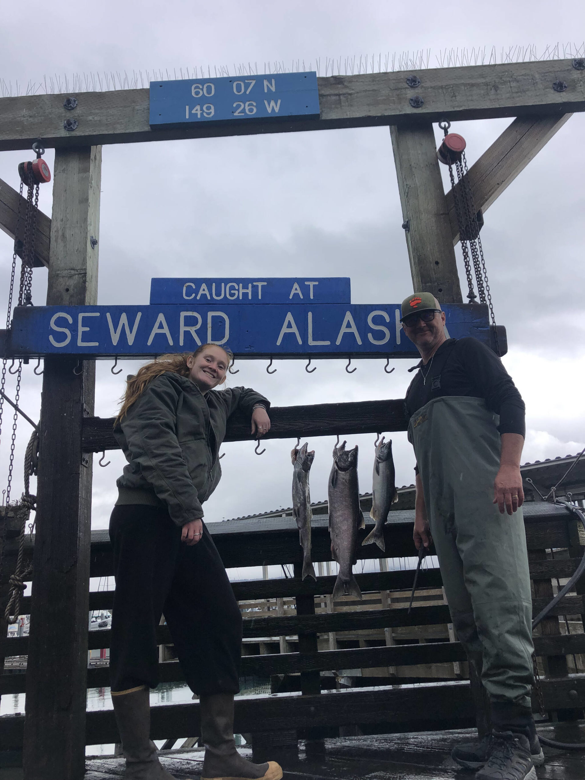 My dad and I pose with our salmon at the Seward harbor on Sept. 8, 2021. (Photo provided)