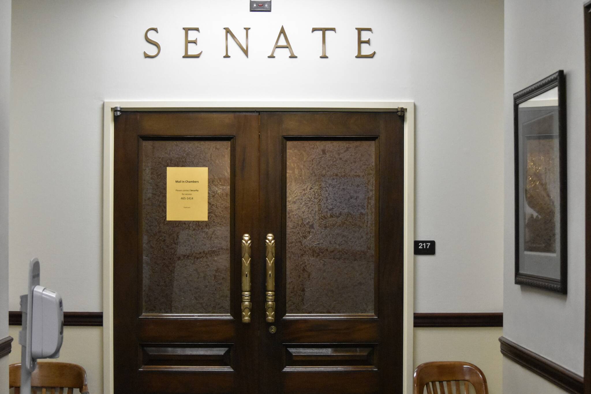 The doors of the Alaska Senate chambers were shut Friday, Oct. 8, 2021, a week into the Alaska State Legislature’s fourth special session of the year. Gov. Mike Dunleavy called lawmakers to session to resolve the state’s longterm fiscal issues, but the same divisions that have kept lawmakers from finding resolution before are still in place. (Peter Segall / Juneau Empire)