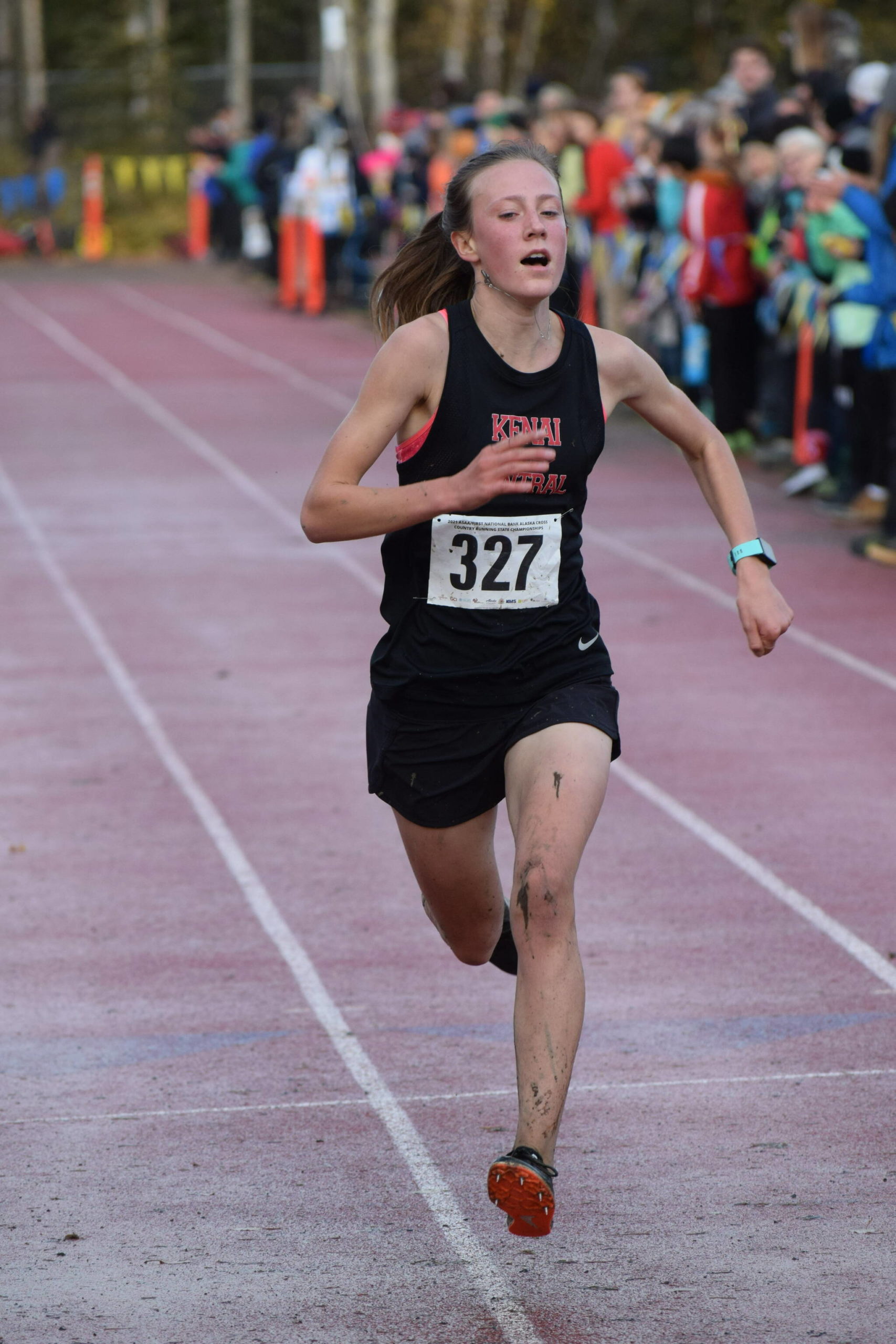 Jayna Boonstra of Kenai races her way to another Division II state cross-country championship at Bartlett High School in Anchorage, Alaska, on Saturday, Oct. 9, 2021. Boonstra finished 5 kilometers in 19 minutes, 47 seconds, to win the sixth individual state title in the last 10 years for the Kardinals girls program. (Camille Botello/Peninsula Clarion)