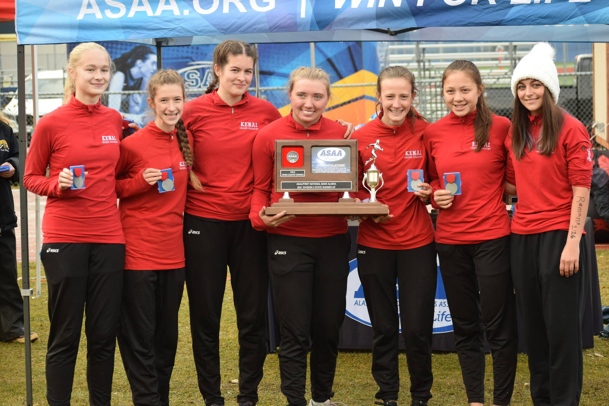 The Kenai Central High School women’s cross country team finishes in second place with 58 points at Bartlett High School in Anchorage, Alaska on Saturday, Oct. 9, 2021. (Camille Botello/Peninsula Clarion)