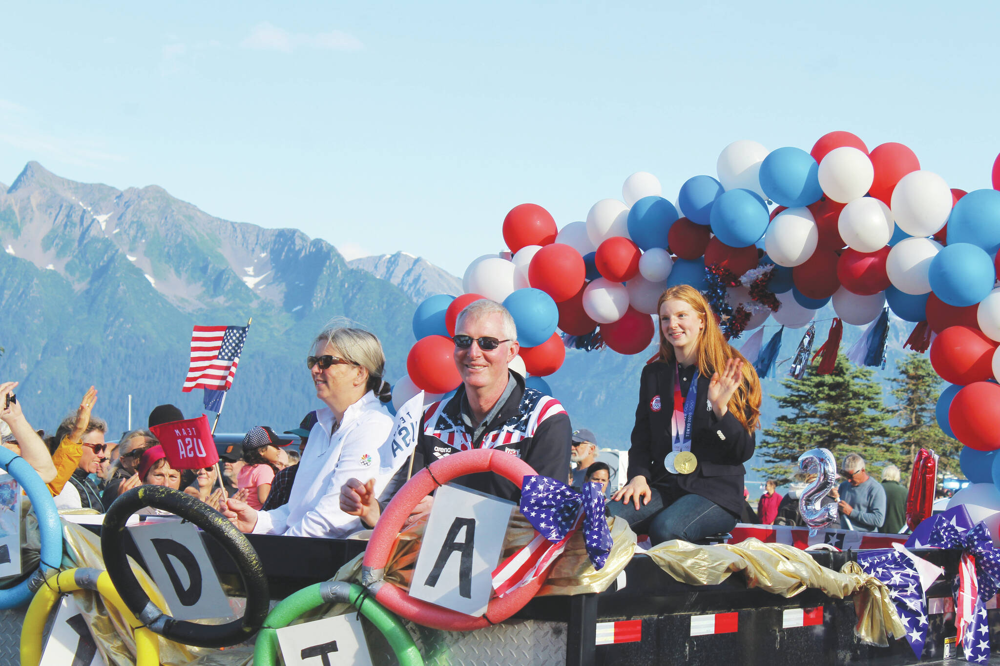 Olympic gold medalist Lydia Jacoby waves to the crowd in Seward during her celebratory parade on Thursday, August 5, 2021. (Ashlyn O’Hara/Peninsula Clarion)