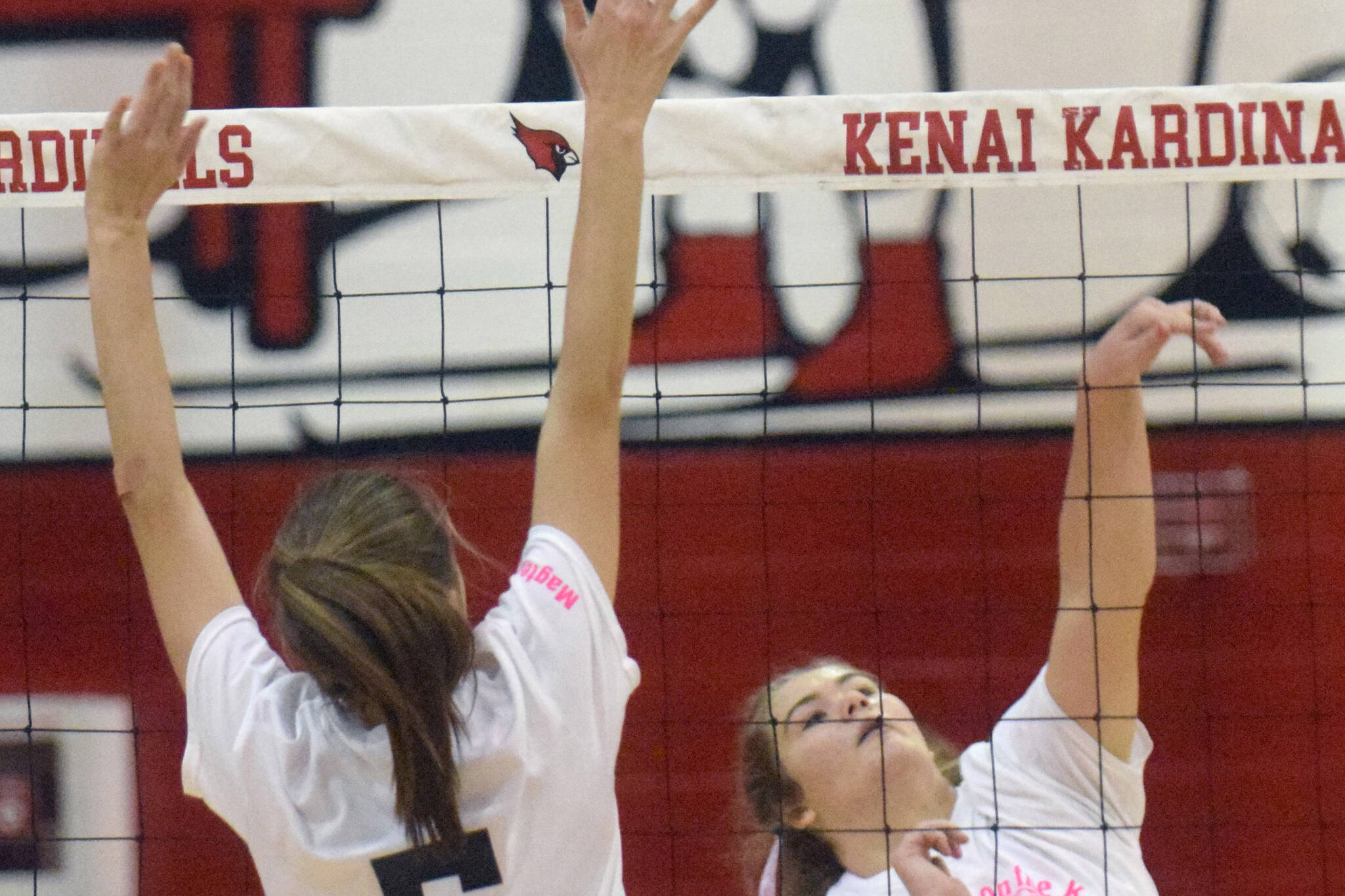 Kenai Central's Emma Beck attacks against Nikiski's Rylee Ellis on Friday, Oct. 15, 2021, at Kenai Central High School in Kenai, Alaska. (Photo by Jeff Helminiak/Peninsula Clarion)