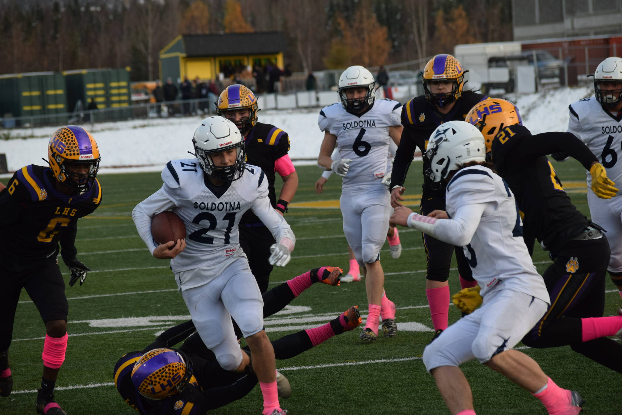 Soldotna junior Brayden Taylor rushes the ball down the field during the Division II state football championship game against Lathrop at Service High School in Anchorage on Saturday, Oct. 16, 2021. (Camille Botello/Peninsula Clarion)