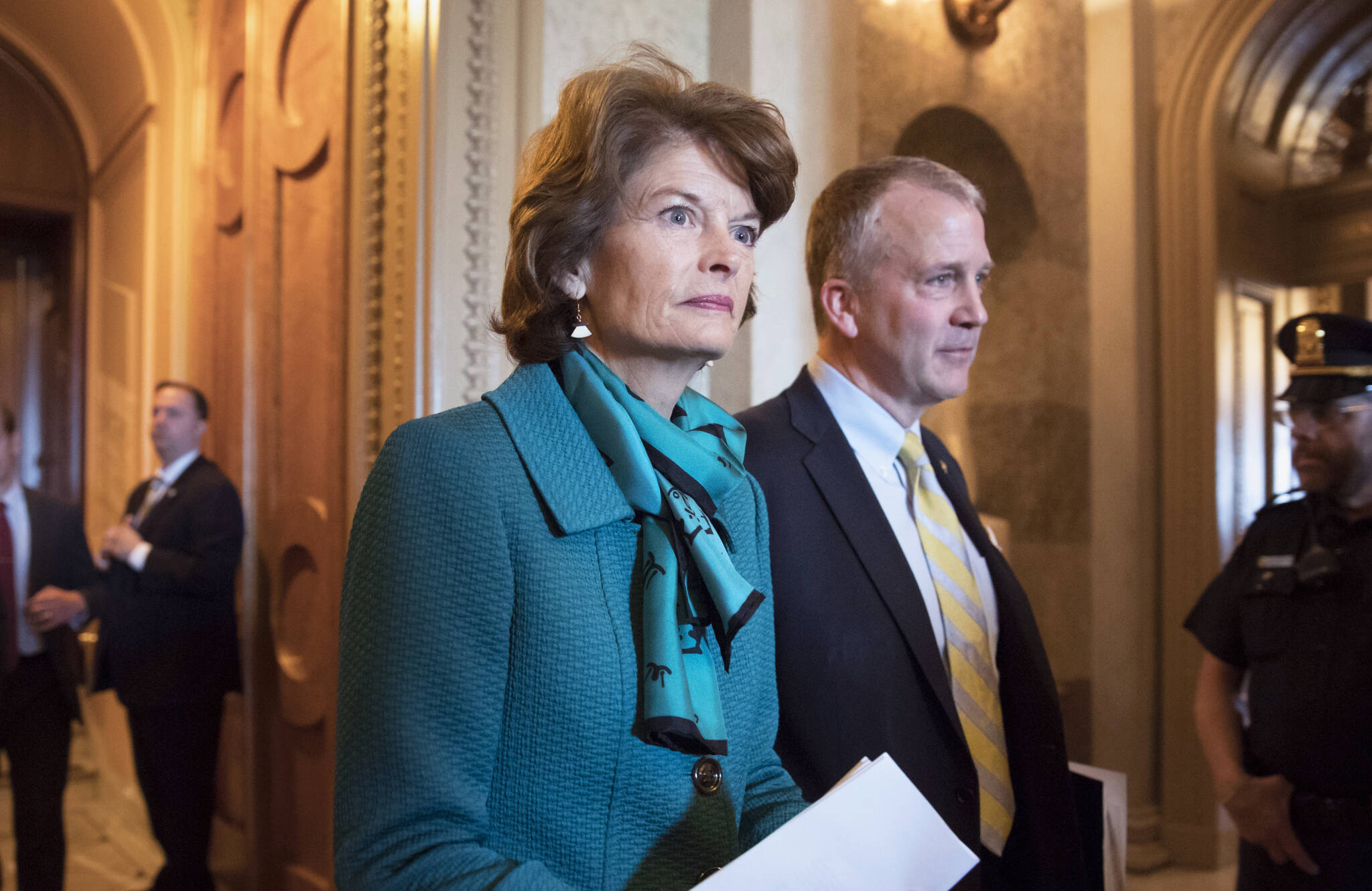 Sen. Lisa Murkowski, R-Alaska, and Sen. Dan Sullivan, R-Ark., leave the chamber after a vote on Capitol Hill in Washington, early Wednesday, May 10, 2017. A magistrate ruled Tuesday, Oct. 19, 2021, that there is probable cause for a case to continue against a man accused of threatening to kill Alaska’s two U.S. senators in profanity-filled voicemails left on their office phones. (AP Photo/J. Scott Applewhite, File)