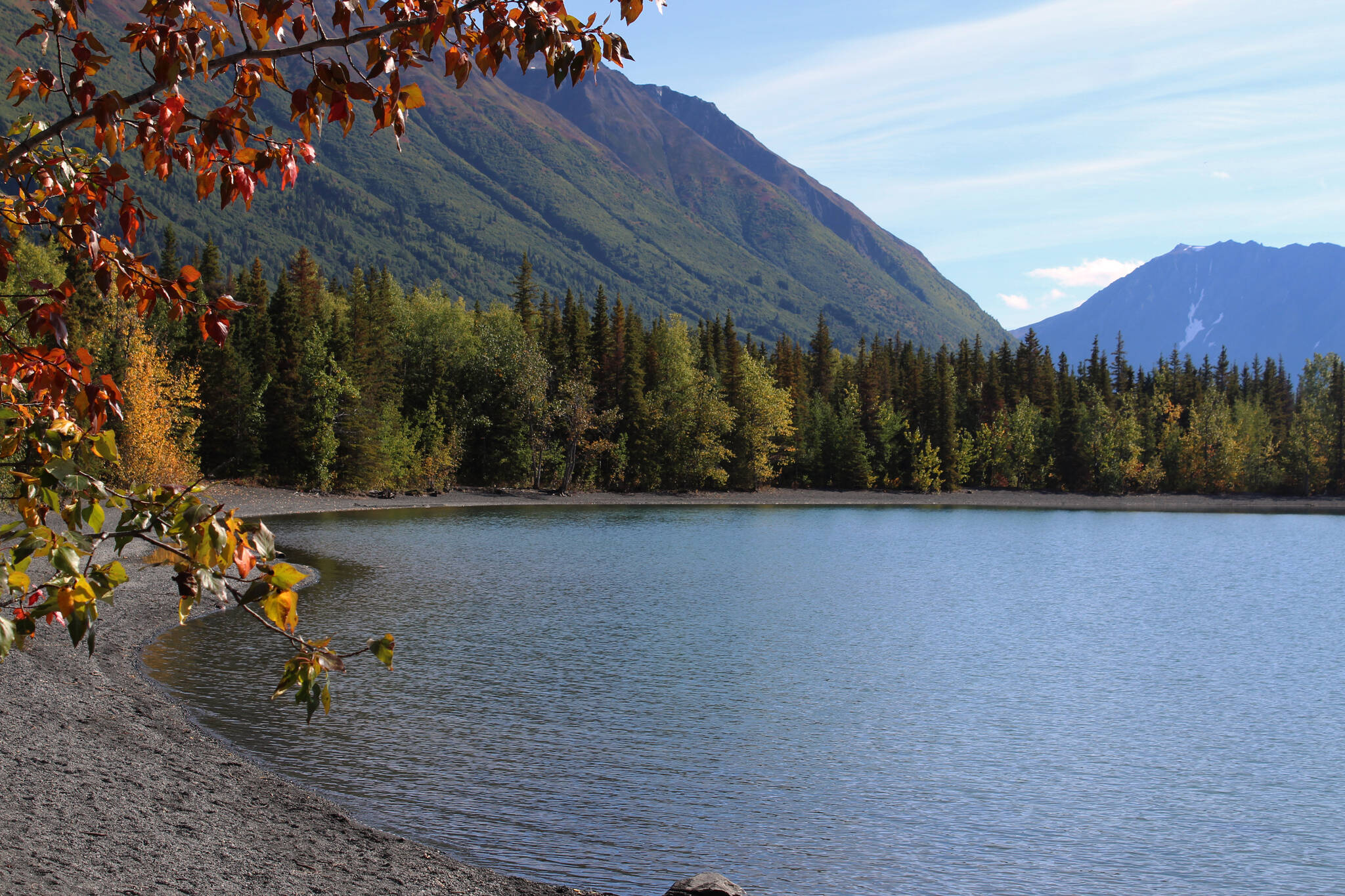 Fall leaves frame a shot of Kenai Lake on Saturday, Sept. 11, 2021 near Cooper Landing, Alaska. (Ashlyn O'Hara/Peninsula Clarion)