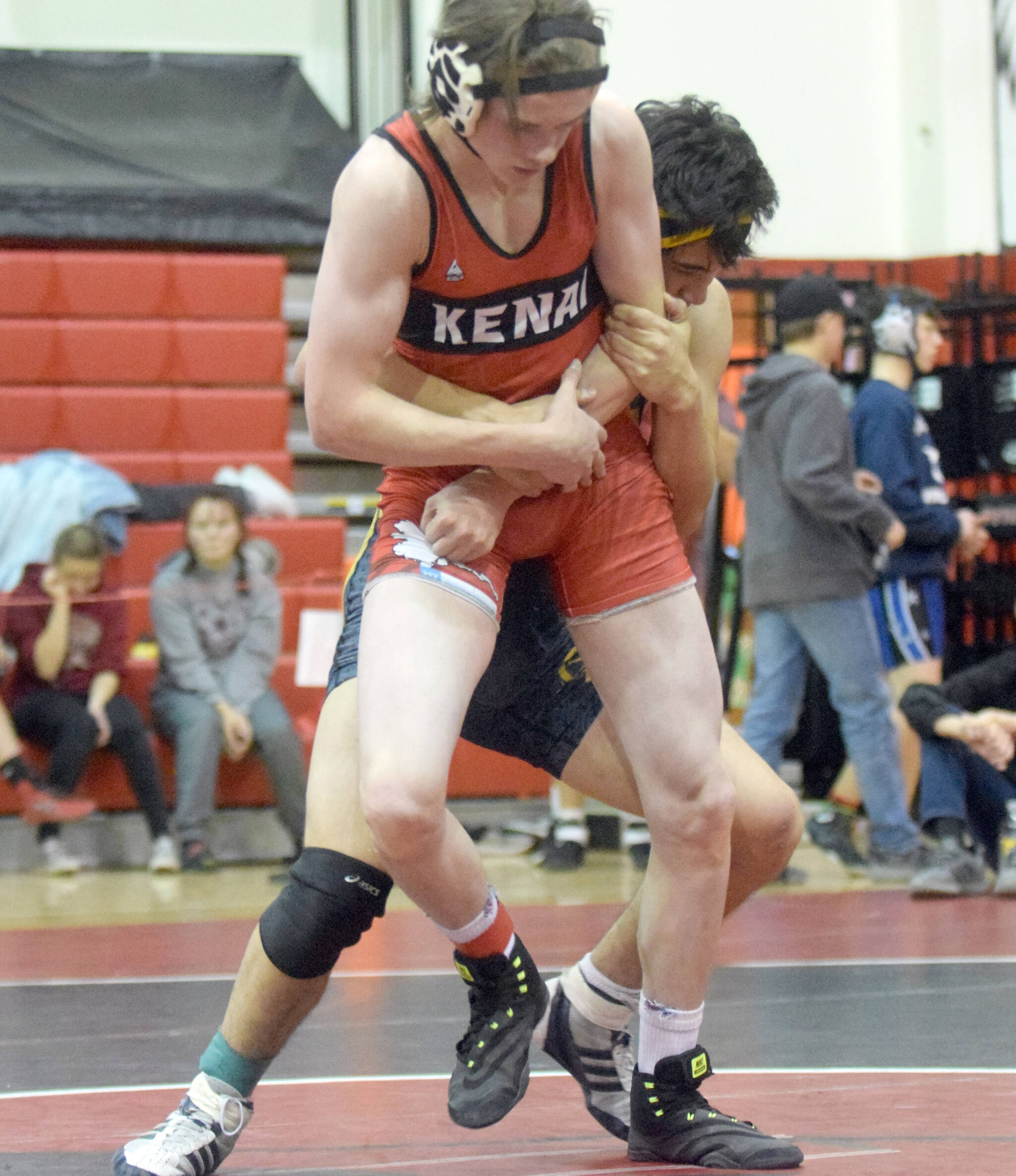 Kenai Central’s Cameron Cook tries to escape from Homer’s Russell Nyvall at the Luke Spruill Memorial Tournament on Saturday, Oct. 23, 2021, at Kenai Central High School. Cook was first at 145 pounds, while Nyvall was third. Nyvall won this match by 7-3 decision. (Photo by Jeff Helminiak/Peninsula Clarion)