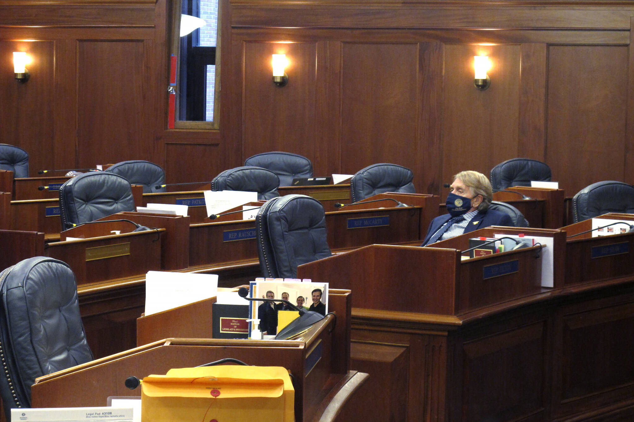 Alaska state Rep. Laddie Shaw, an Anchorage Republican, waits for the start of a so-called technical session on the House floor, Wednesday, Oct. 20, 2021, in Juneau, Alaska. The fourth special legislative session of the year began Oct. 4, in Juneau, but there has been little action at the Capitol and little progress toward resolving Alaska’s fiscal issues. (AP Photo/Becky Bohrer)
