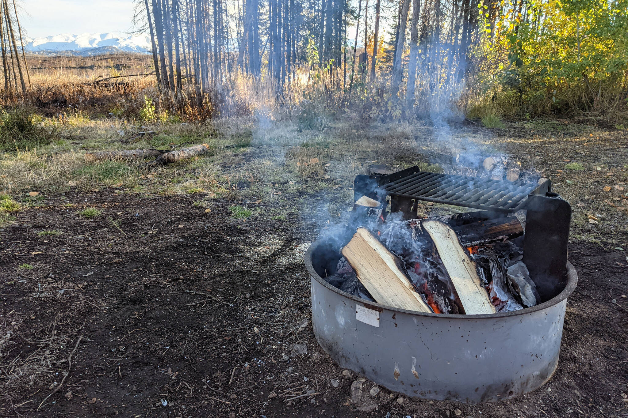 Firewood is burned at a campground at Kelly Lake in the Kenai National Wildlife Refuge in Alaska in September 2021. (Erin Thompson/Peninsula Clarion file)