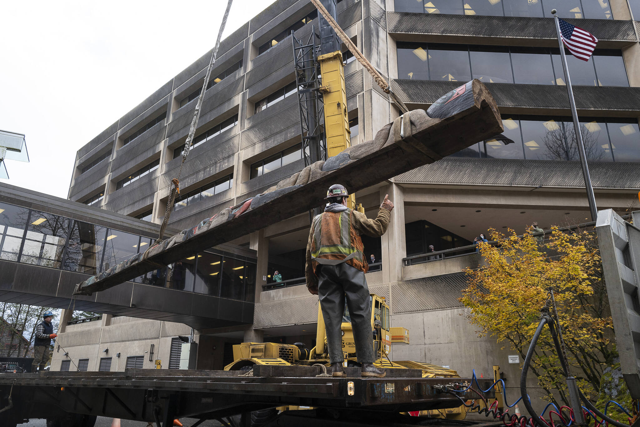 photo by Michael Penn / For the Jundeau-Douglas City Museum
It took two forklifts, a large crane, a flatbed truck and a team of workers to move the Wooshkeetaan Kootéeyaa (totem pole) to its new location inside the atrium of the State Office Building on Oct. 15.
