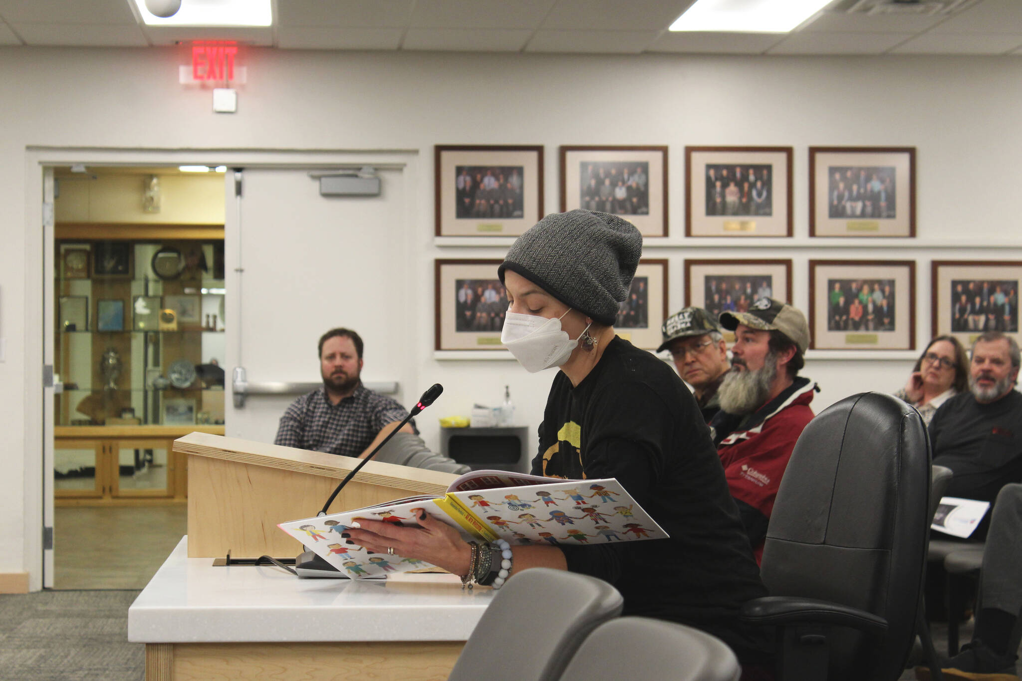 KPBSD Itinerant Counselor Natali Jones reads “All Are Welcome” by Alexandra Penfold in support of the LGBTQ+ community during a meeting of the Kenai Peninsula Borough School District Board of Education on Monday, Nov. 1, 2021 in Soldotna, Alaska. Treatment of LGBTQ+ students within the school district dominated public testimony during the board’s Monday night meeting. (Ashlyn O’Hara/Peninsula Clarion)