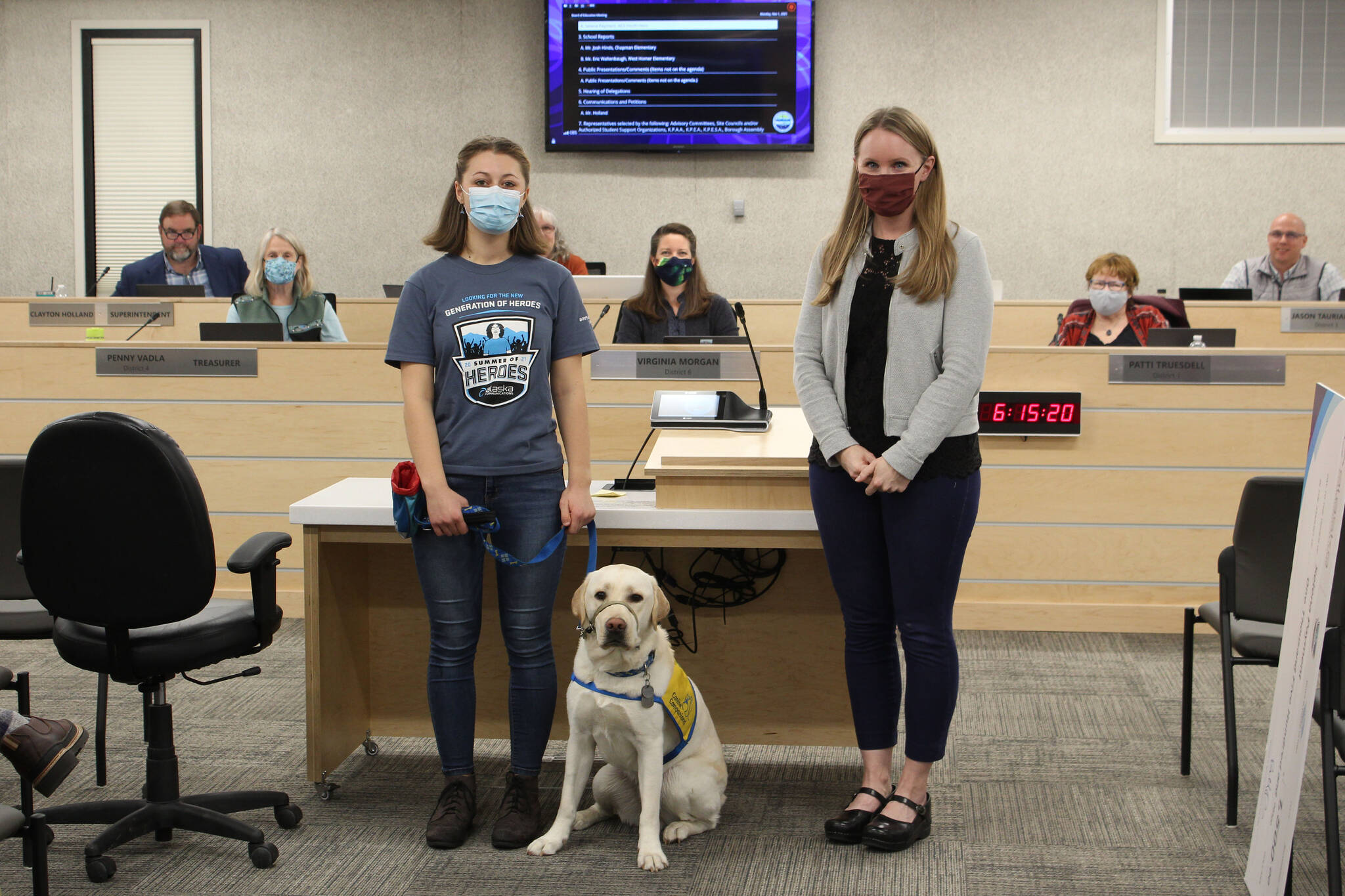 River City Academy junior Selena Payment (left) and Heather Marron stand with Payment’s service dog-in-training, Boots, ahead of the Kenai Peninsula Borough School District Board of Education on Monday in Soldotna. Payment, 16, was named a 2021 youth hero through Alaska Communications’ Summer of Heroes program and was honored by the board Monday. (Ashlyn O’Hara/Peninsula Clarion)
Selena Payment (left) and Heather Marron stand with Payment’s service dog-in-training, Boots, before the Kenai Peninsula Borough School District Board of Education on Monday, Nov. 1, 2021 in Soldotna, Alaska. Payment was named a 2021 youth hero through Alaska Communications’ Summer of Heroes program and was honored by the board Monday. (Ashlyn O’Hara/Peninsula Clarion)