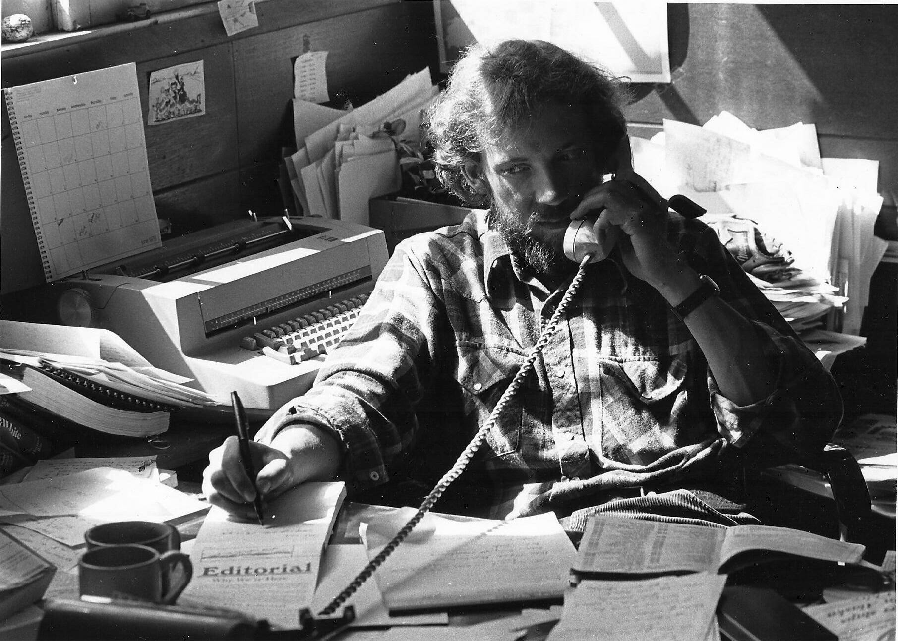 Tom Kizzia works at the Homer News in a photo taken about 1978 in Homer, Alaska. (Homer News photo)
