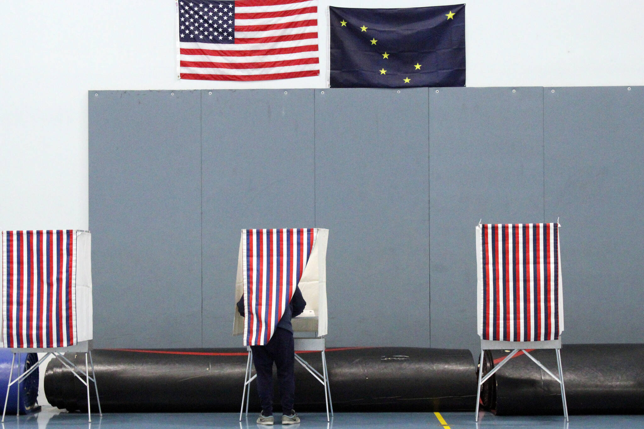A voter fills out their ballot in the Thunder Mountain High School gymnasium during the 2020 general election. With more than a year to go before the 2022 election, spending is ramping up. (Ben Hohenstatt / Juneau Empire File)