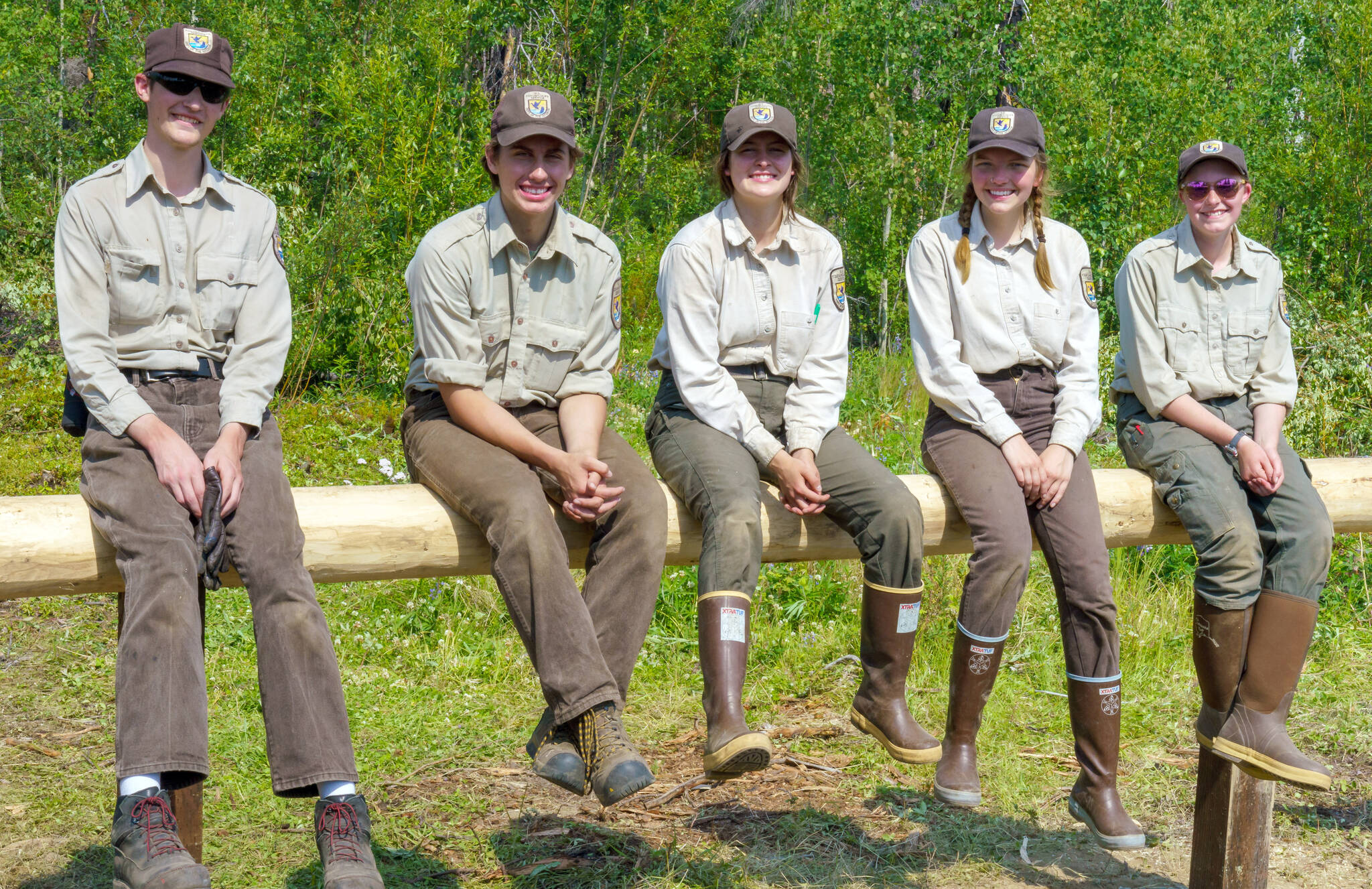 The 2021 YCC Crew sits on a newly constructed hitching post at Nurses Cabin in July 2021. Left to right are Ryan Crapps, Jacob Begich, Leah Fallon, Melita Efta and Olivia Somers. (Photo by USFWS/Heather Sokul)