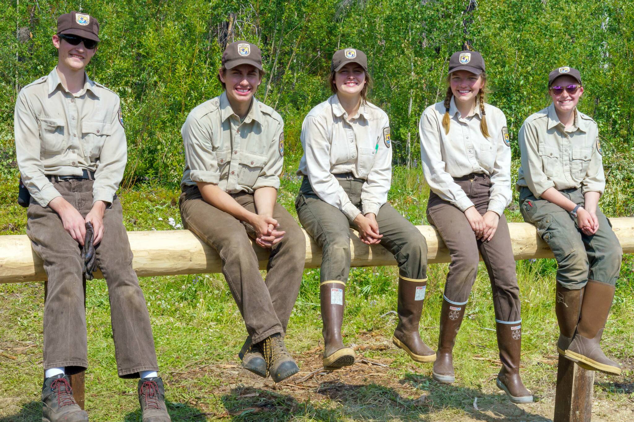 The 2021 YCC Crew sits on a newly constructed hitching post at Nurses Cabin in July 2021. Left to right are Ryan Crapps, Jacob Begich, Leah Fallon, Melita Efta and Olivia Somers. (Photo by USFWS/Heather Sokul)