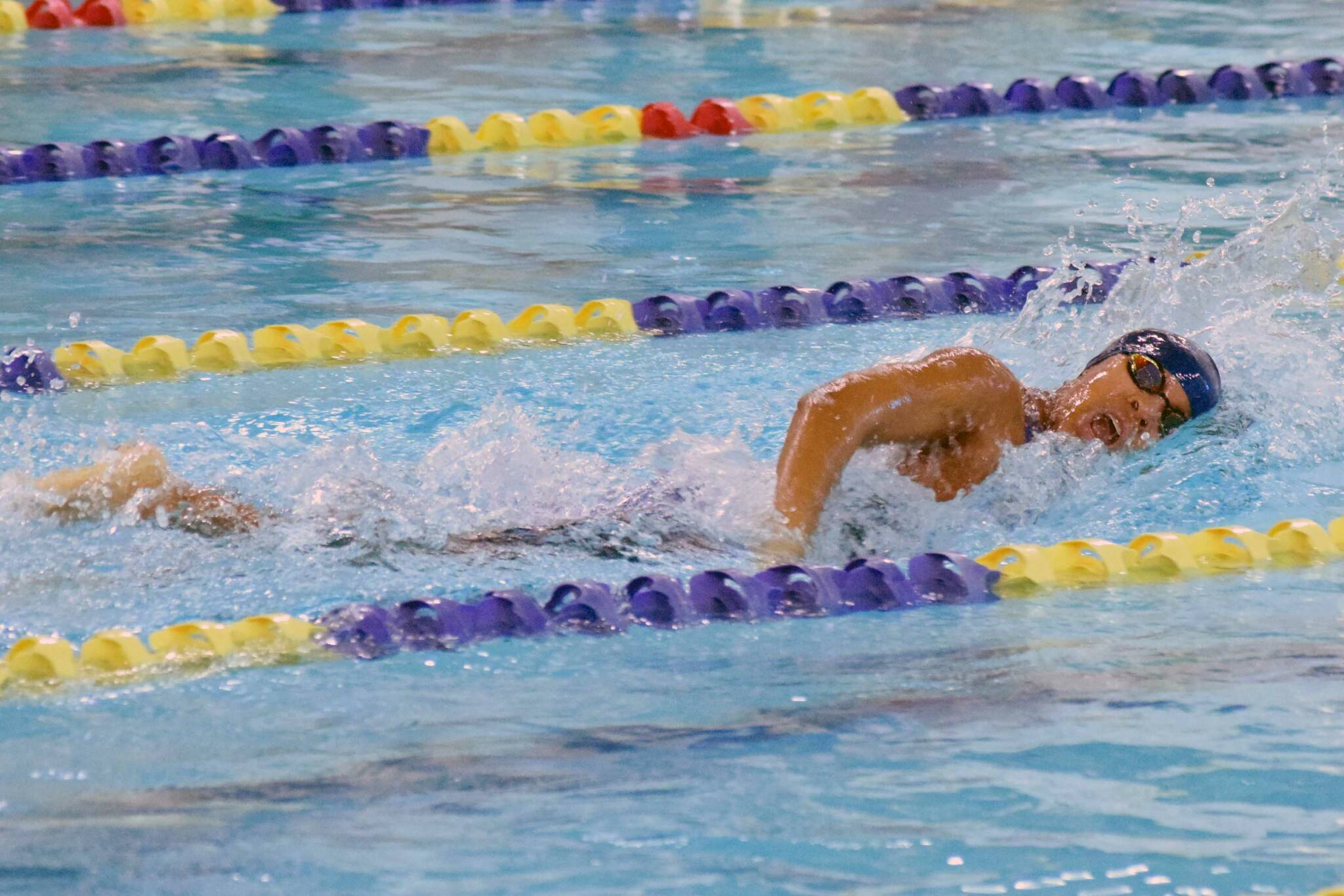 Homer's Jillian Crooks competes in the state swimming finals at Bartlett High School in Anchorage on Saturday, Nov. 6, 2021. (Camille Botello/Peninsula Clarion)