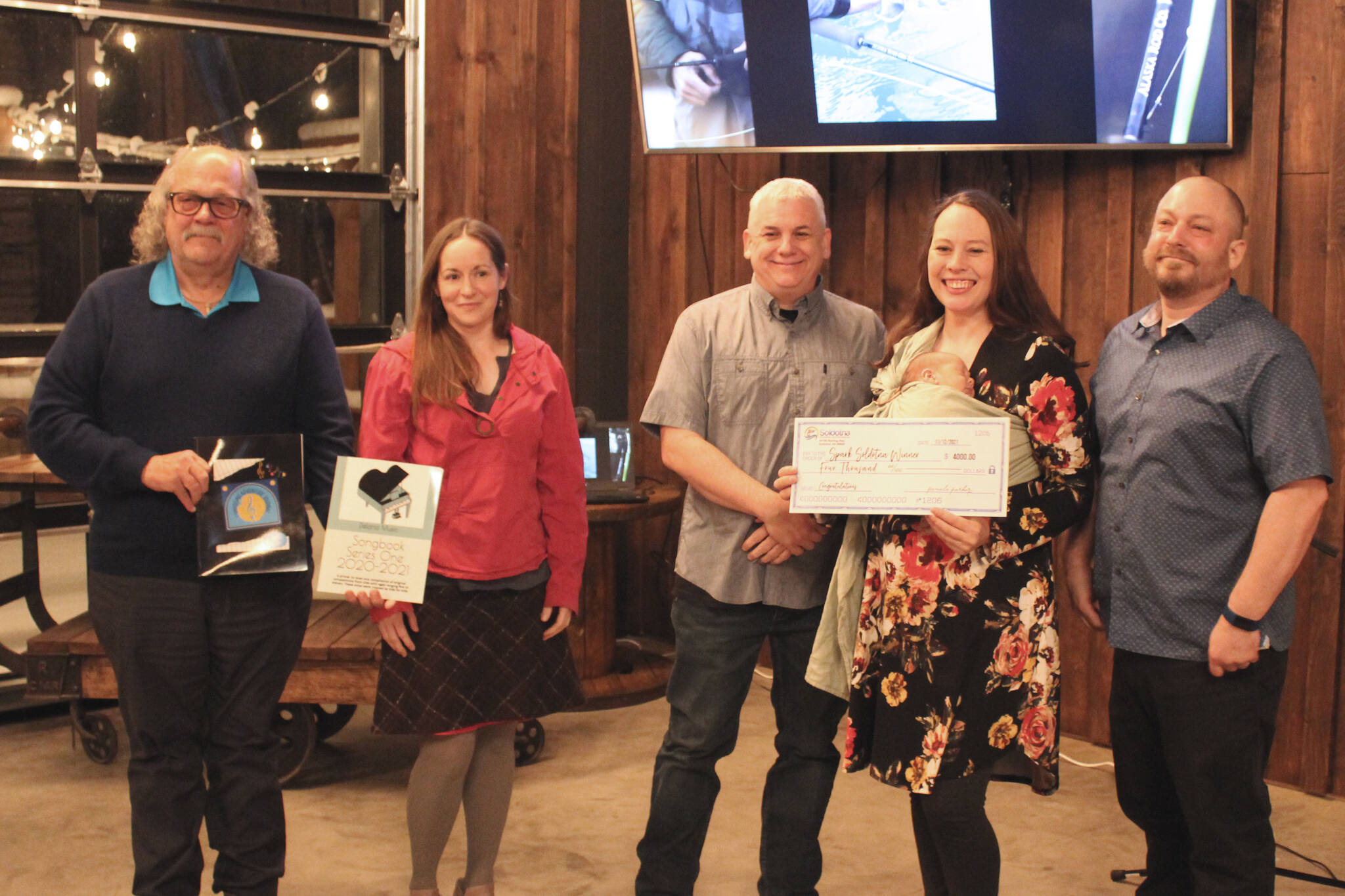Delana Green, second from right, poses Friday with judges during the “Spark Soldotna” event at the Lone Moose Lodge. From left: Steve Horn, retired Kenai Peninsula College Associate Professor of Business; Jenny Neyman, KDLL general manager; Tim Jordan, of Northern Tech Group; Delana Green, winner; and Kenai Peninsula Borough Assembly member Tyson Cox.