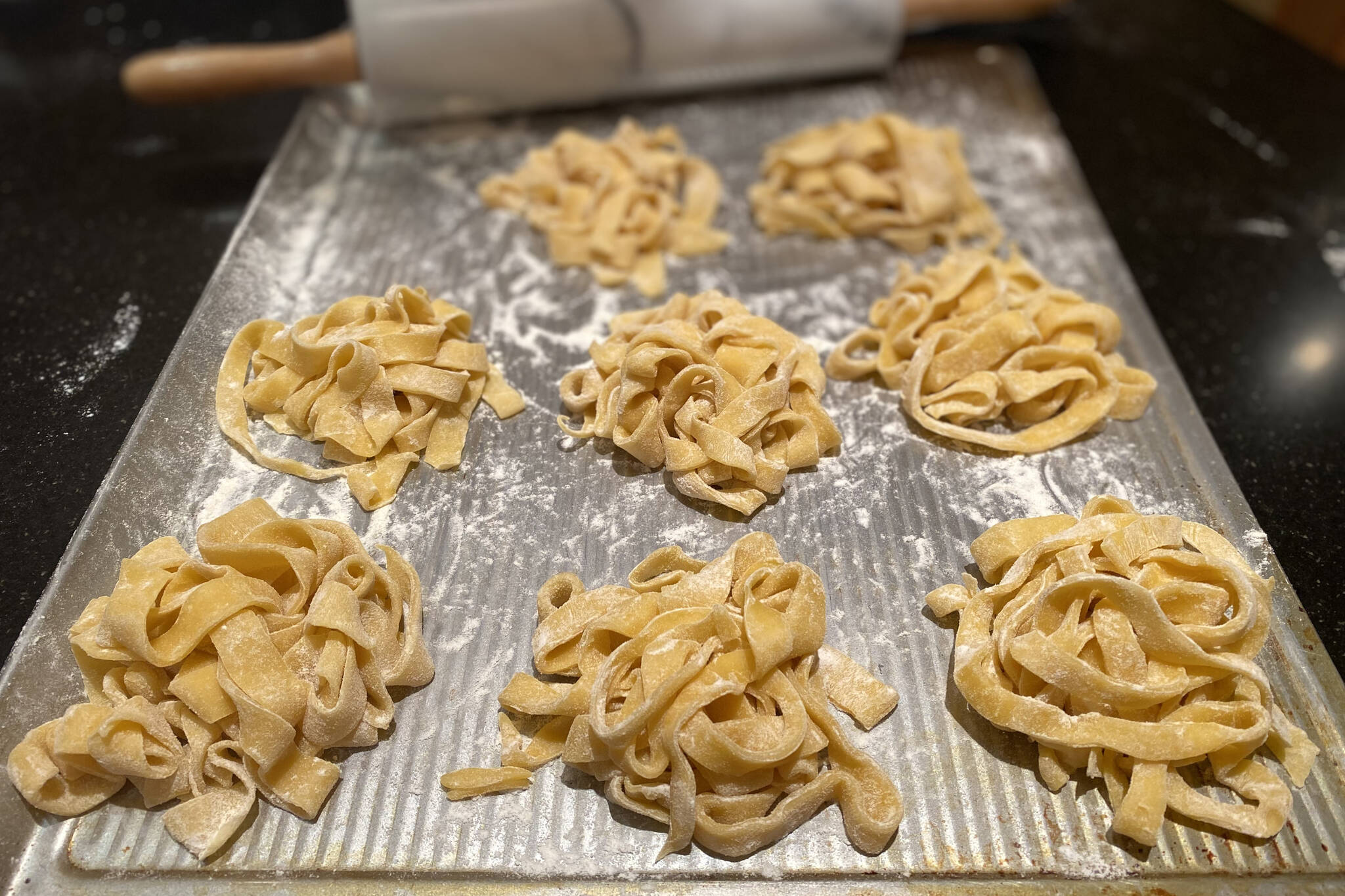 Before boiling, this handmade pasta is rolled, cut and tossed in flour to keep from sticking. (Photo by Tressa Dale/Peninsula Clarion)