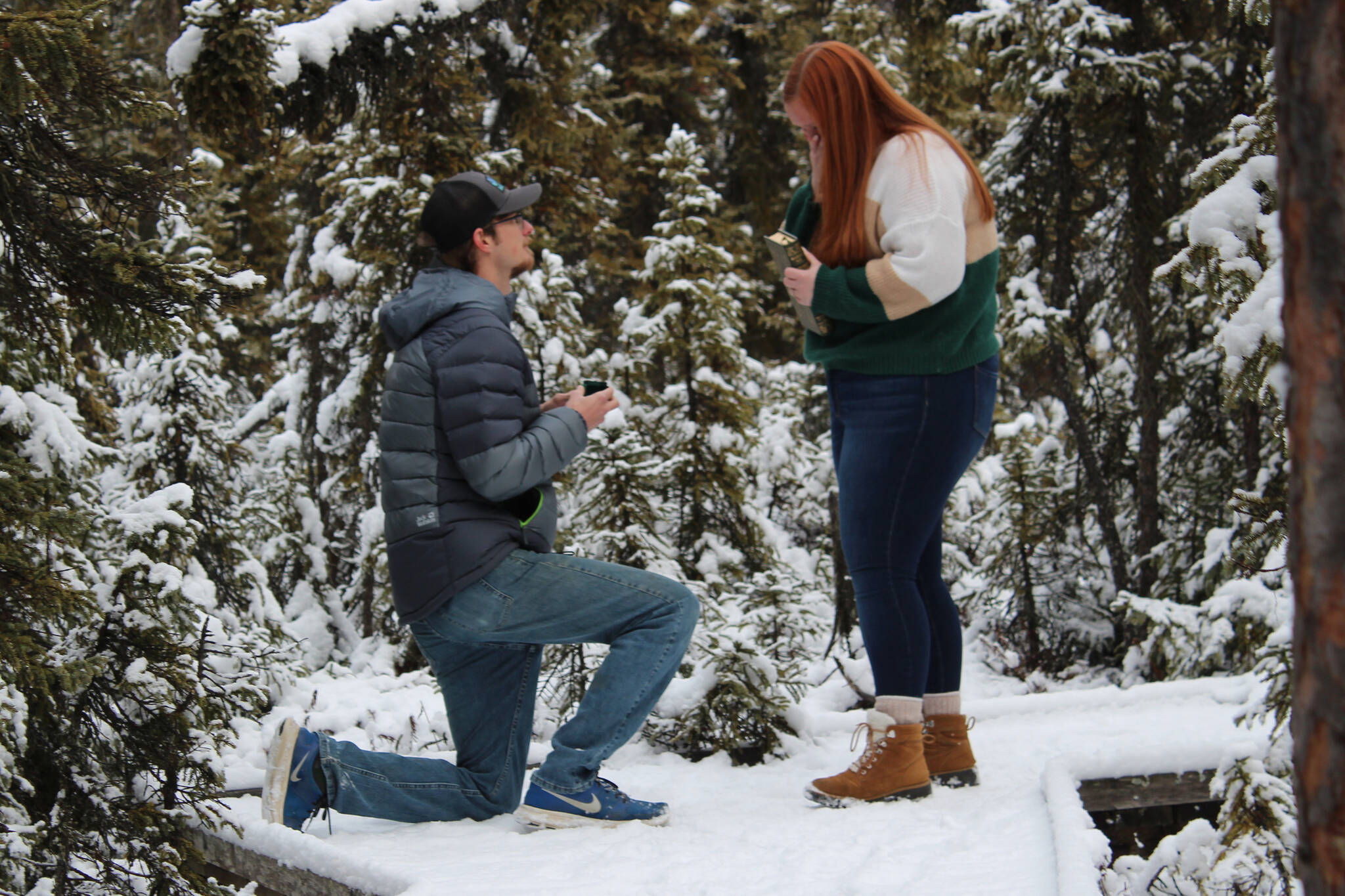 Michael proposes to Sarah at the Kenai National Wildlife Refuge on Sunday, Nov. 7, 2021. (Photo by Ashlyn O’Hara/Peninsula Clarion)