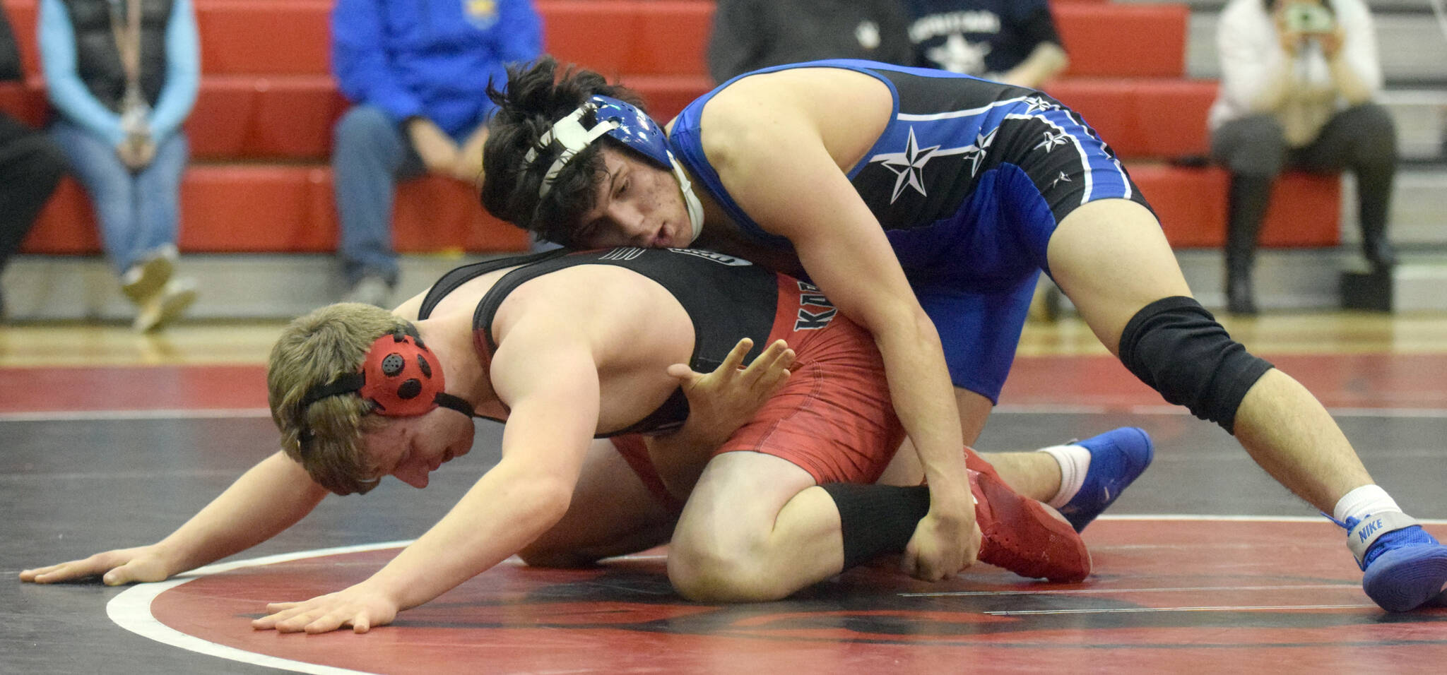 Soldotna’s Isaac Chavarria wrestles to a major decision over Kenai Central’s Andrew Gaethle at 152 pounds during a dual meet at Kenai Central High School on Tuesday, Nov. 16, 2021, in Kenai, Alaska. (Photo by Jeff Helminiak/Peninsula Clarion)