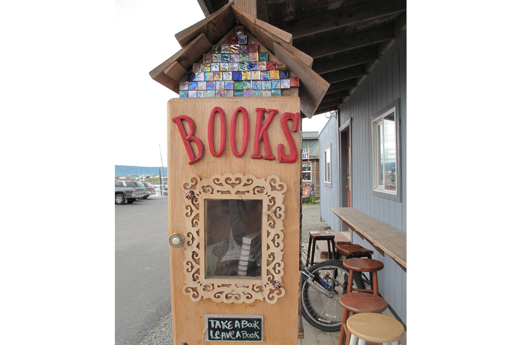 A little library at La Baleine on the Homer Spit is one of several around town, as seen here in July 2015. (Homer News file photo)