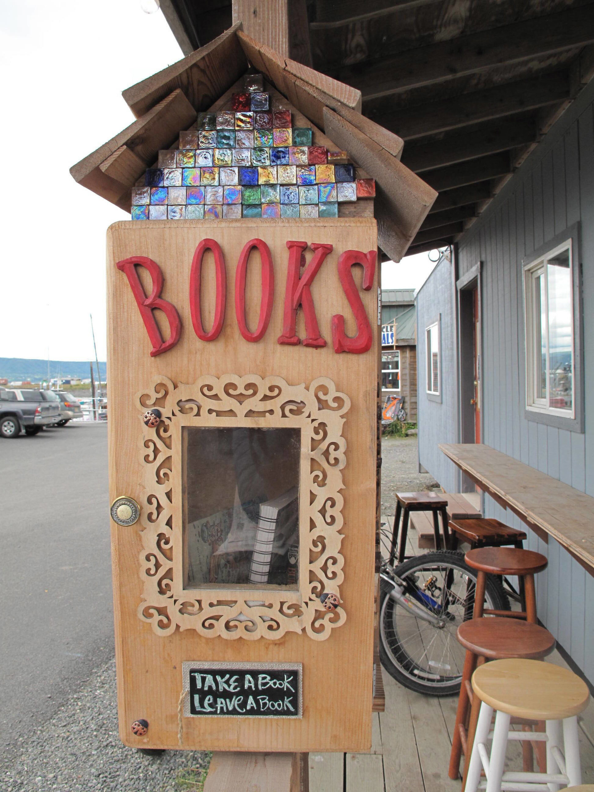 A little library at La Baleine on the Homer Spit is one of several around town, as seen here in July 2015. (Homer News file photo)