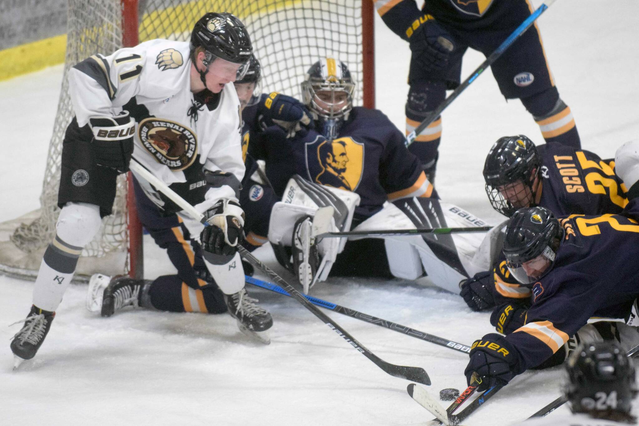 Kenai River Brown Bears forward Bryce Monrean tries to find a way through the defense of the Springfield (Illinois) Jr. Blues during a first-period power play Friday, Nov. 19, 2021, at the Soldotna Regional Sports Complex. (Photo by Jeff Helminiak/Peninsula Clarion)
