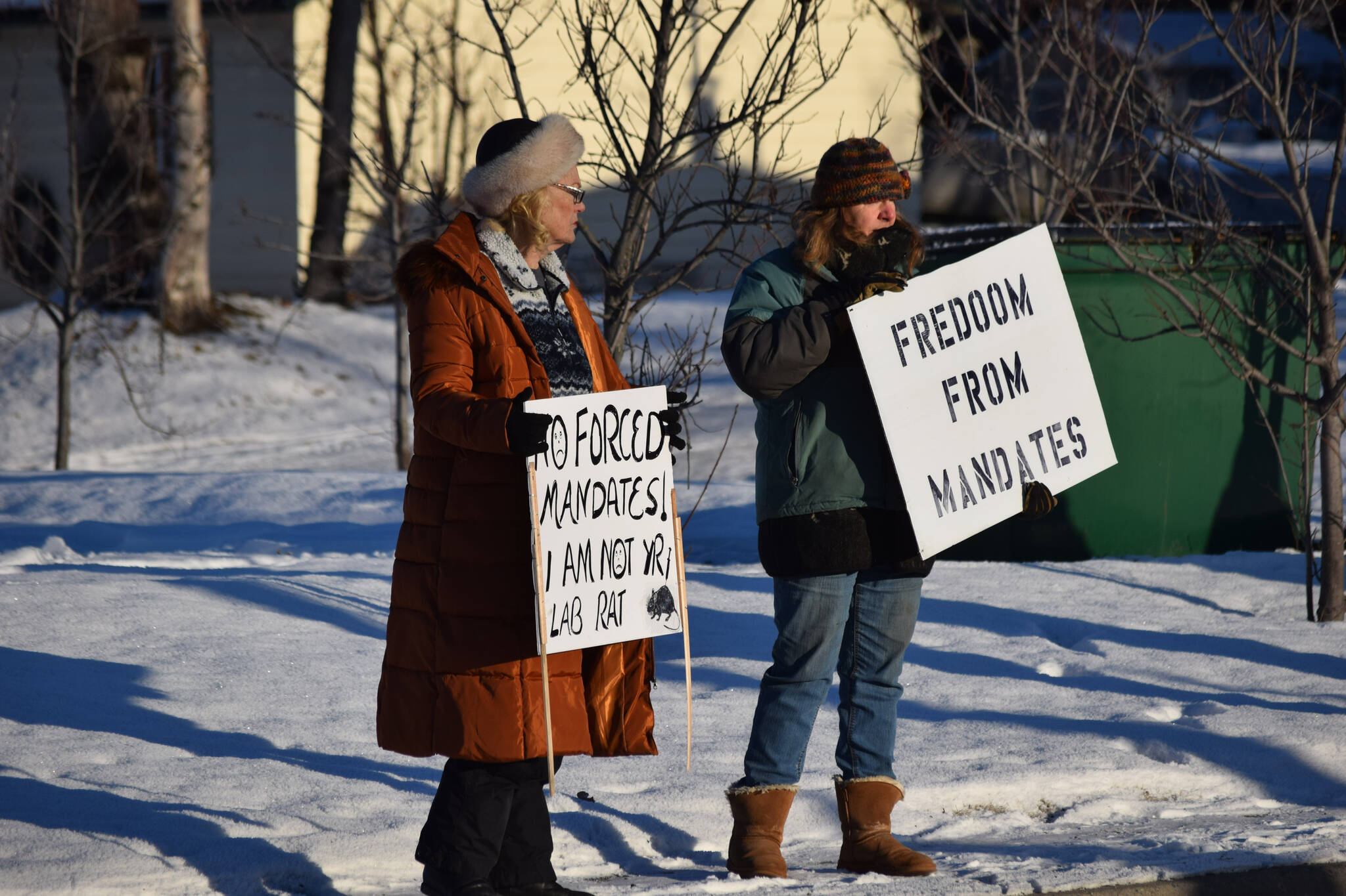 Demonstrators gather outside of Central Peninsula Hospital in Soldotna to protest COVID-19 vaccine mandates and advocate for alternative treatments on Saturday, Nov. 20, 2021. (Camille Botello/Peninsula Clarion)