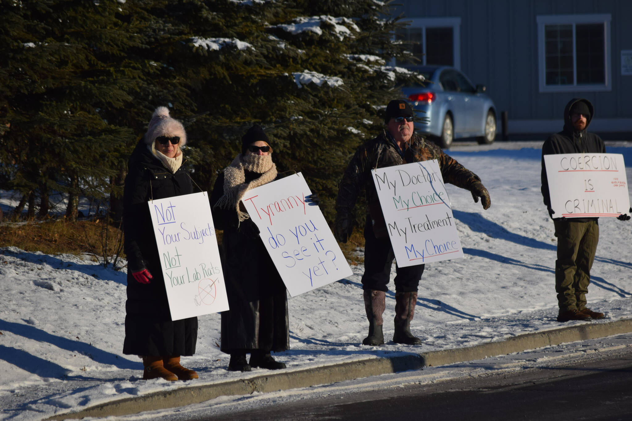 Demonstrators gather outside of Central Peninsula Hospital in Soldotna to protest COVID-19 vaccine mandates and advocate for alternative treatments on Saturday, Nov. 20, 2021. (Camille Botello/Peninsula Clarion)