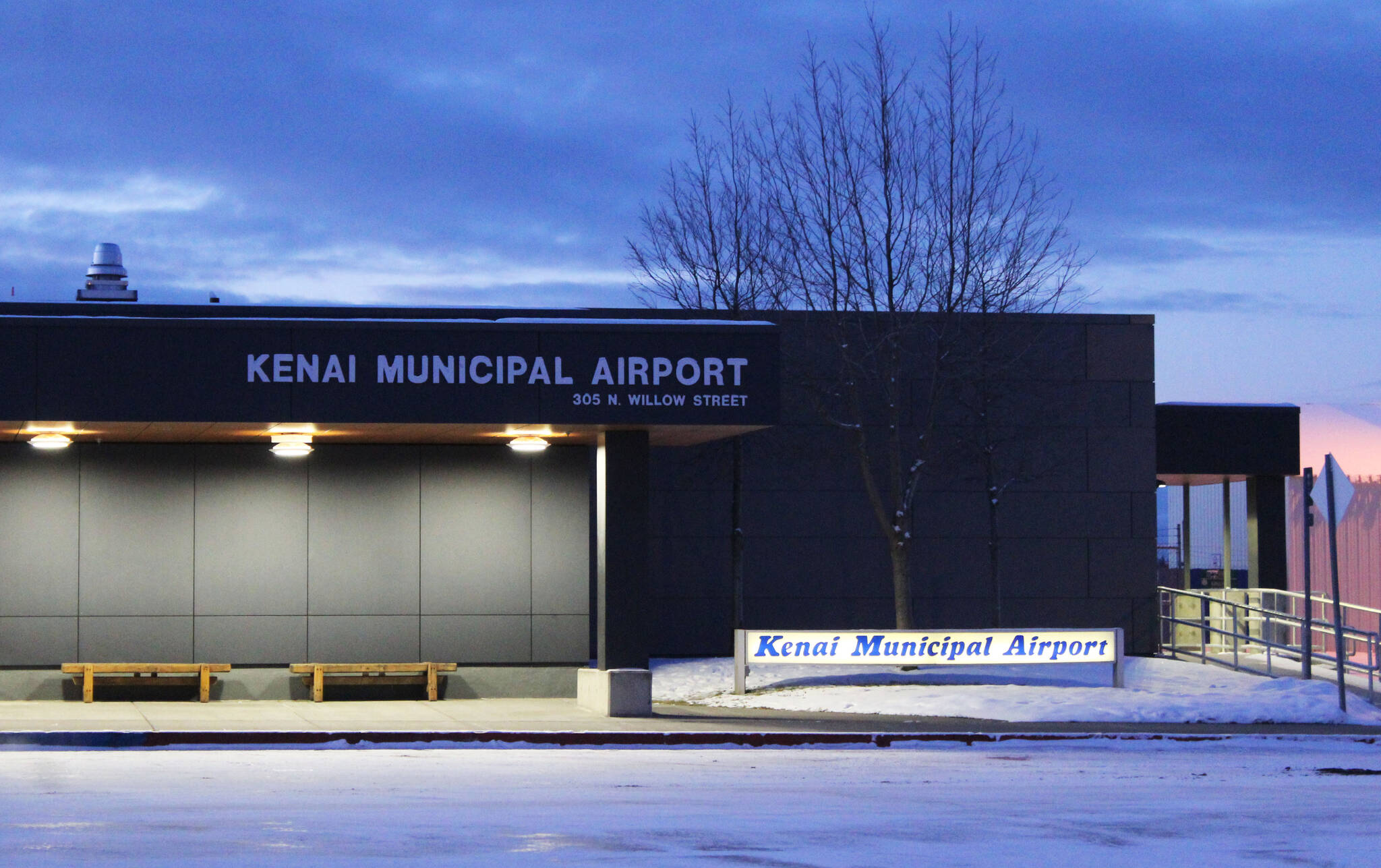 Signs welcome travelers to the Kenai Municipal Airport on Tuesday, Nov. 23, 2021 in Kenai, Alaska. (Ashlyn O’Hara/Peninsula Clarion)