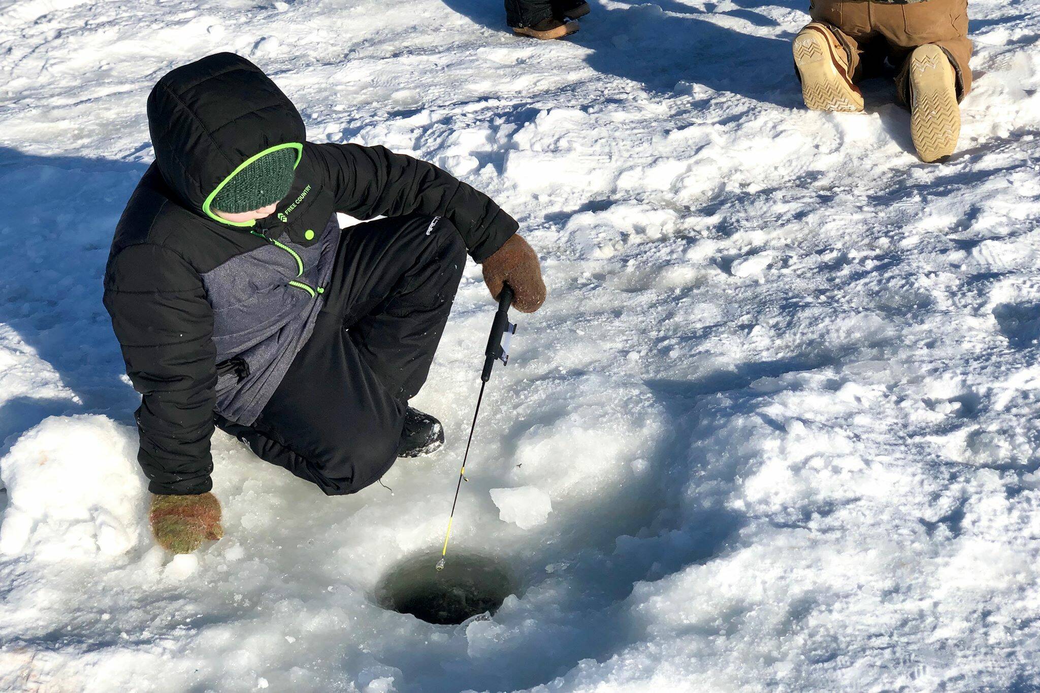 Students from Tustamena Elementary School join classes from around the central Kenai Peninsula for a day of ice fishing with the Alaska Department of Fish and Game on Sport Lake on Thursday, Feb. 27, 2020 near Soldotna, Alaska. (Photo by Victoria Petersen/Peninsula Clarion)