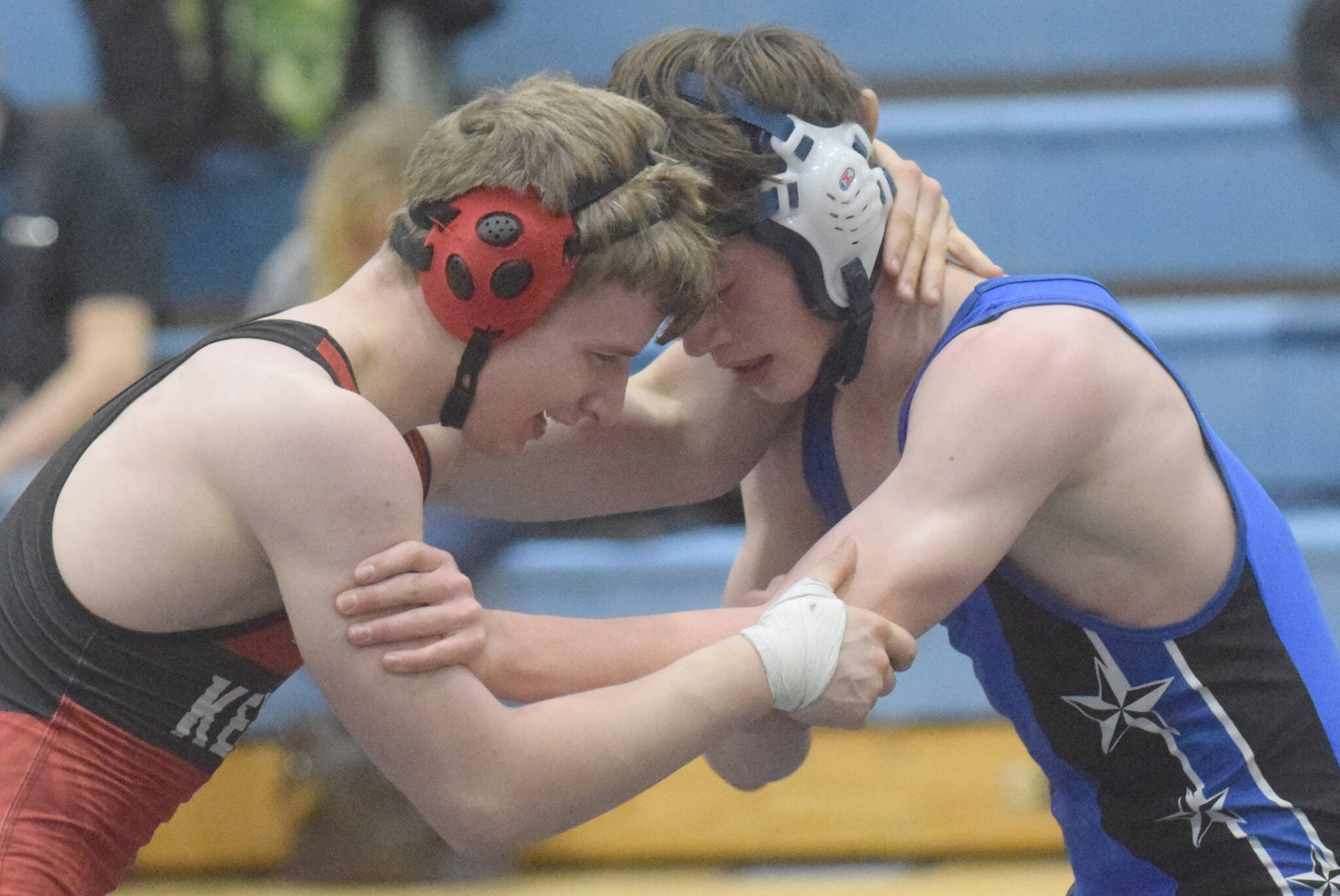 Kenai Central’s Andrew Gaethle and Soldotna’s Collin Peck battle at 160 pounds in a dual meet at Soldotna High School on Tuesday, Nov. 30, 2021, in Soldotna, Alaska. Gaethle notched an 8-3 decision.