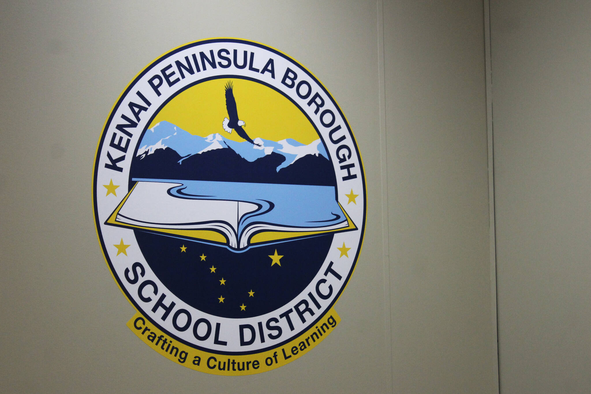 The logo for the Kenai Peninsula Borough School District is displayed inside the George A. Navarre Borough Admin Building on Thursday, July 22, 2021 in Soldotna, Alaska. (Ashlyn O’Hara/Peninsula Clarion)