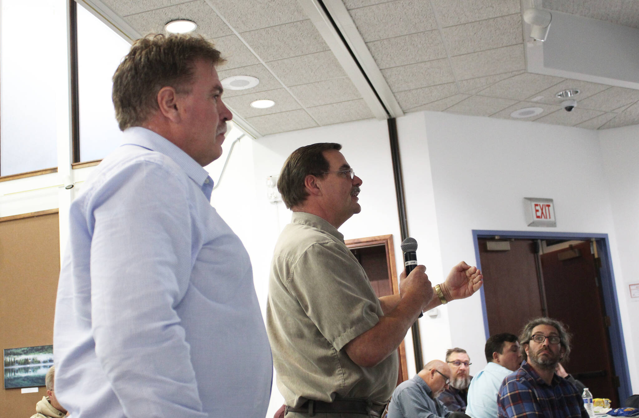 Kenai Mayor Brian Gabriel (left) and Kenai City Council Member Henry Knackstedt speak at a joint work session at the Kenai Chamber of Commerce and Visitor Center on Monday, Oct. 11, 2021 in Kenai, Alaska. (Ashlyn O’Hara/Peninsula Clarion)