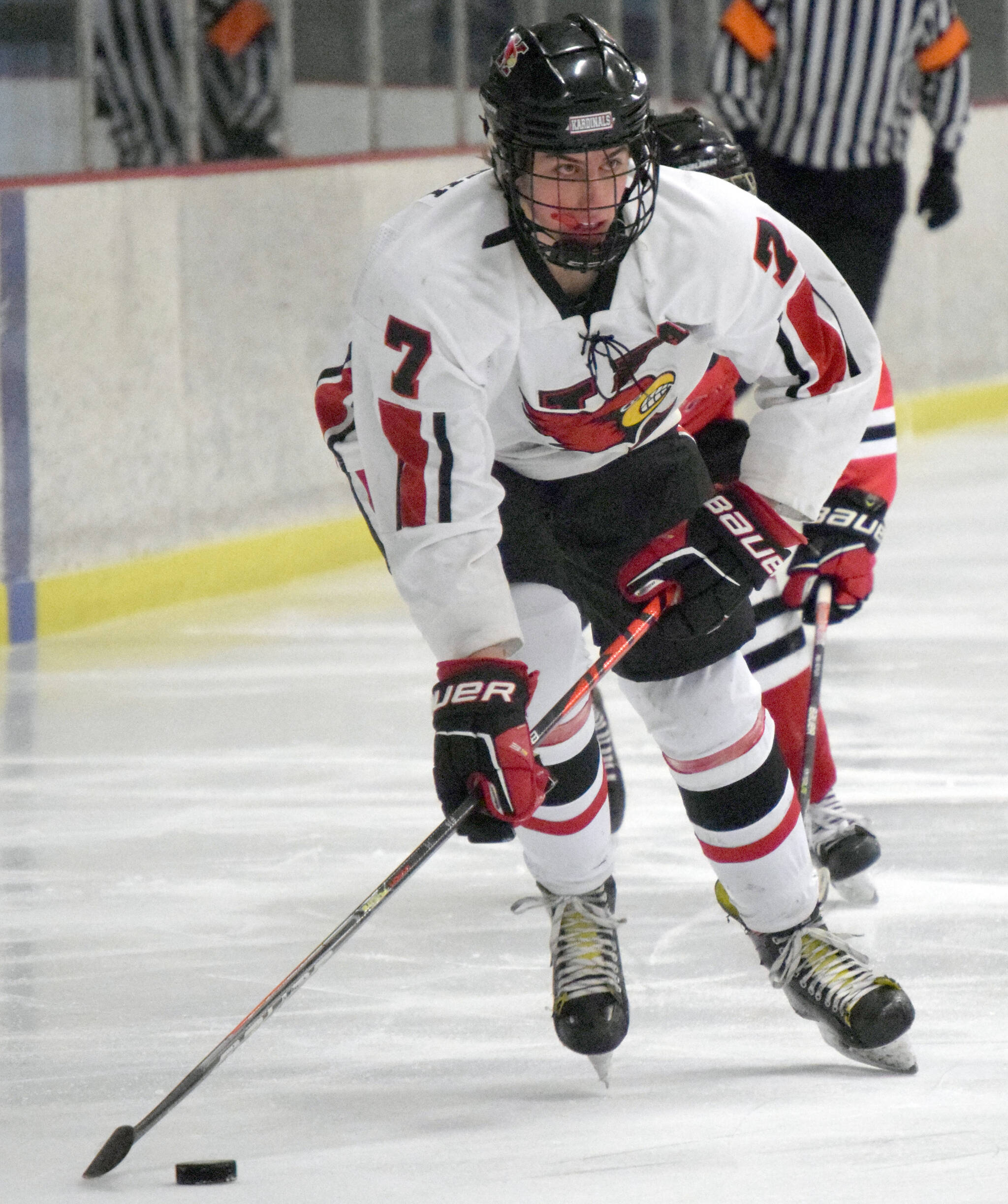 Kenai Central’s Jacob Begich skates in for a first-period goal on Saturday, Dec. 4, 2021, against Juneau-Douglas at the Kenai Multi-Purpose Facility in Kenai, Alaska. (Photo by Jeff Helminiak/Peninsula Clarion)