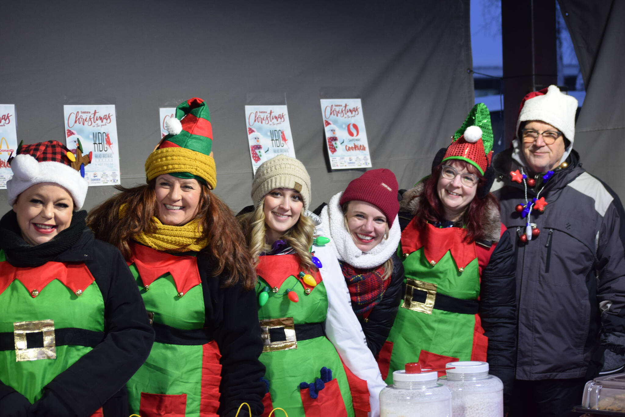 The organizers of Soldotna Christmas in the Park set up the snack table at Soldotna Creek Park on Saturday, Dec. 4, 2021. (Camille Botello/Peninsula Clarion)