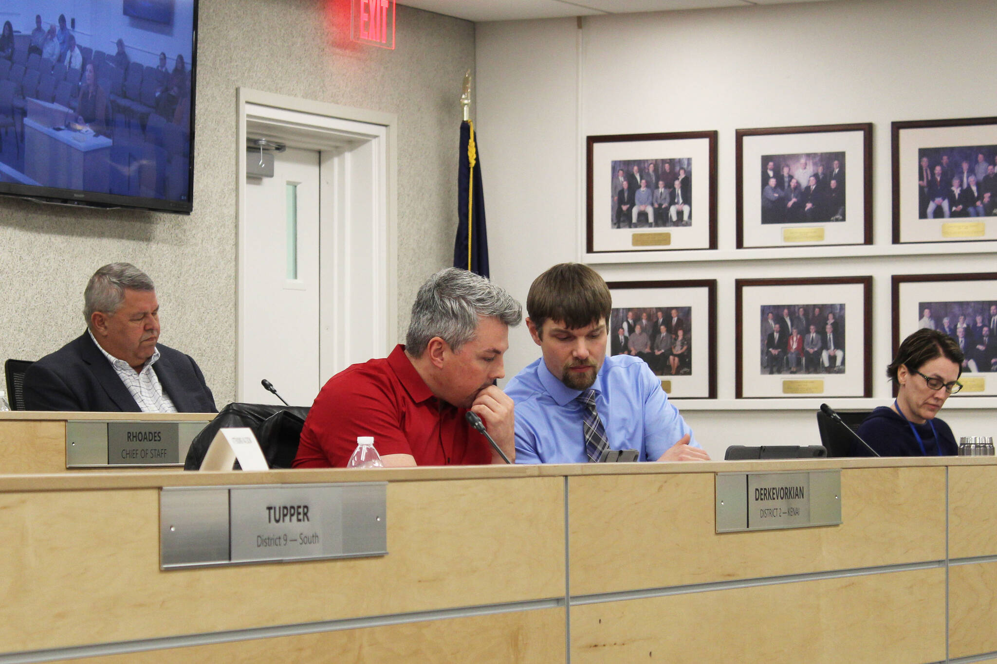 Assembly members Richard Derkevorkian (left) and Jesse Bjorkman (right) consult during a meeting of the Kenai Peninsula Borough Assembly on Tuesday, Dec. 7, 2021 in Soldotna, Alaska. (Ashlyn O'Hara)