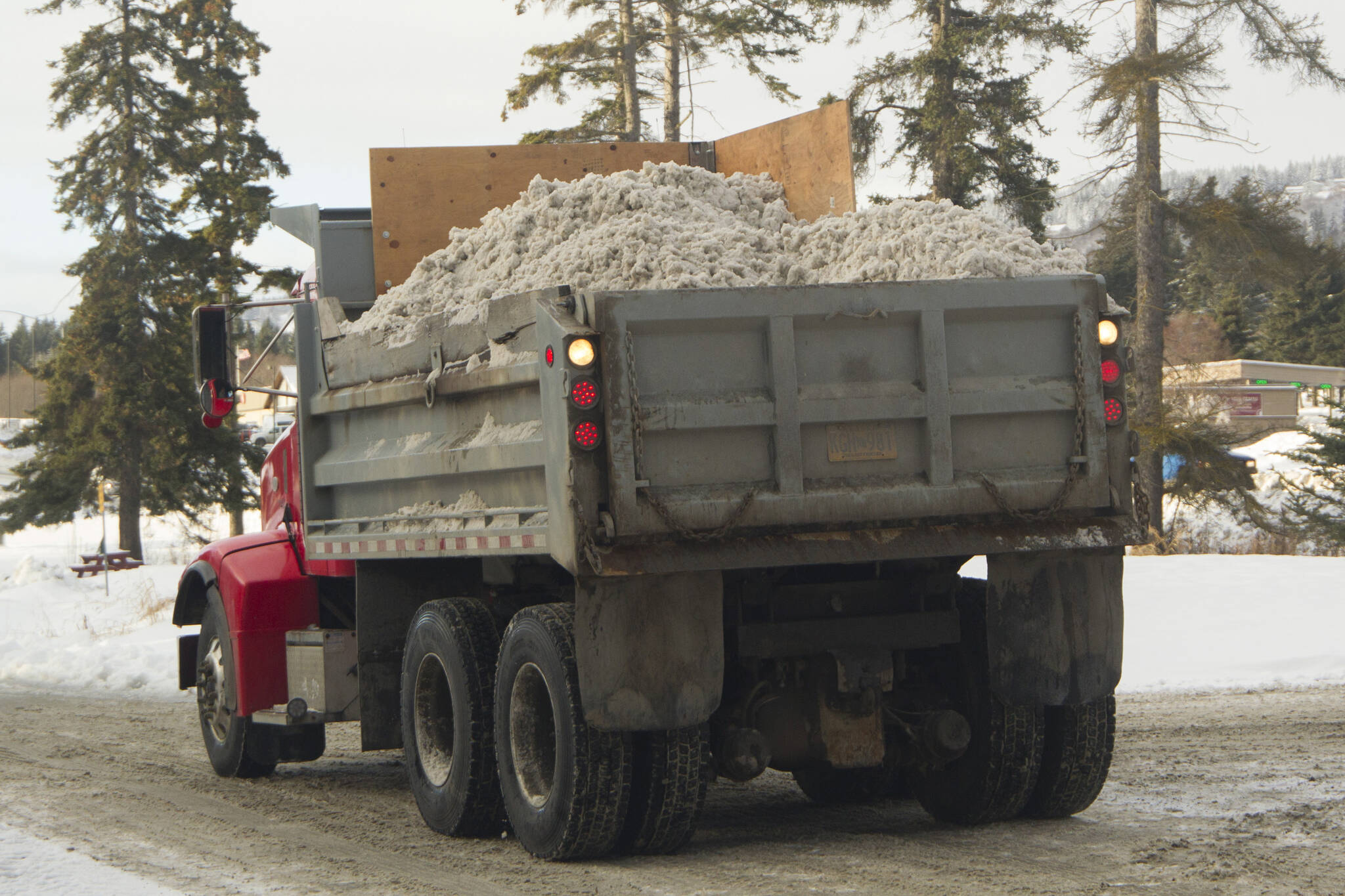 A truck carries snow recently plowed in Homer, Alaska, on Dec. 7, 2021. (Photo by Sarah Knapp/Homer News)