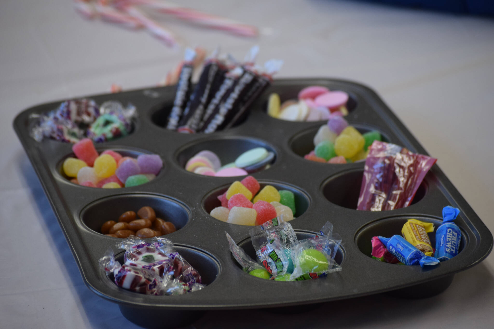 An array of sweets were used by kids making homemade gingerbread houses at the Nikiski Community Recreation Center on Saturday, Dec. 11, 2021, in Nikiski, Alaska. (Camille Botello/Peninsula Clarion)
