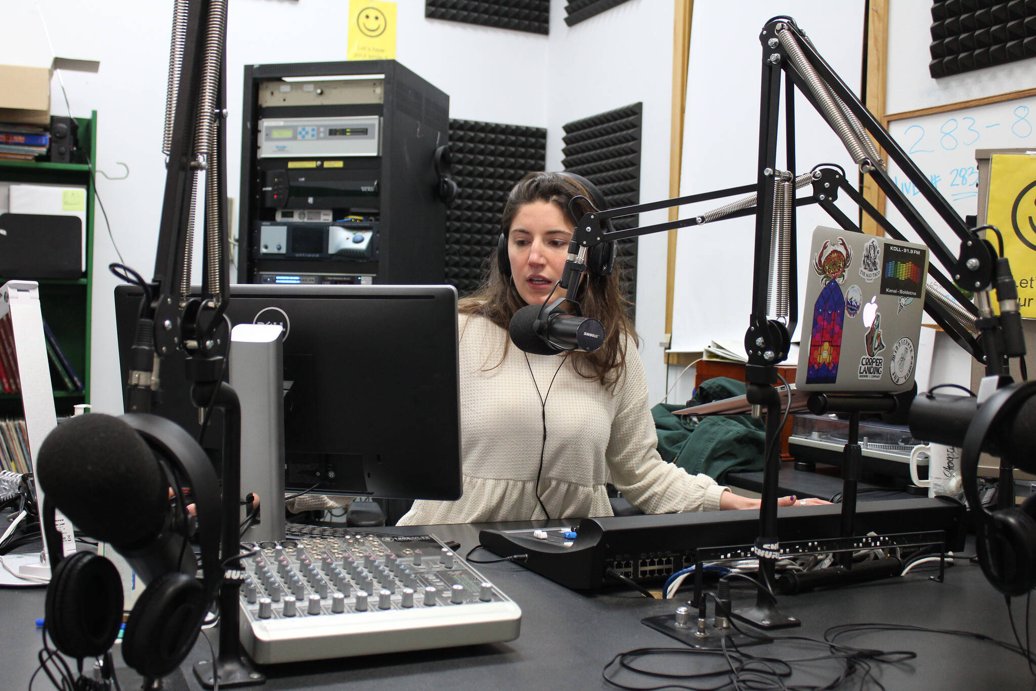 Sabine Poux anchors KDLL’s evening news show on Monday, Dec. 13, 2021 in Kenai, Alaska. KDLL will add a reporter to its staff through the Report for America program. (Ashlyn O’Hara/Peninsula Clarion)