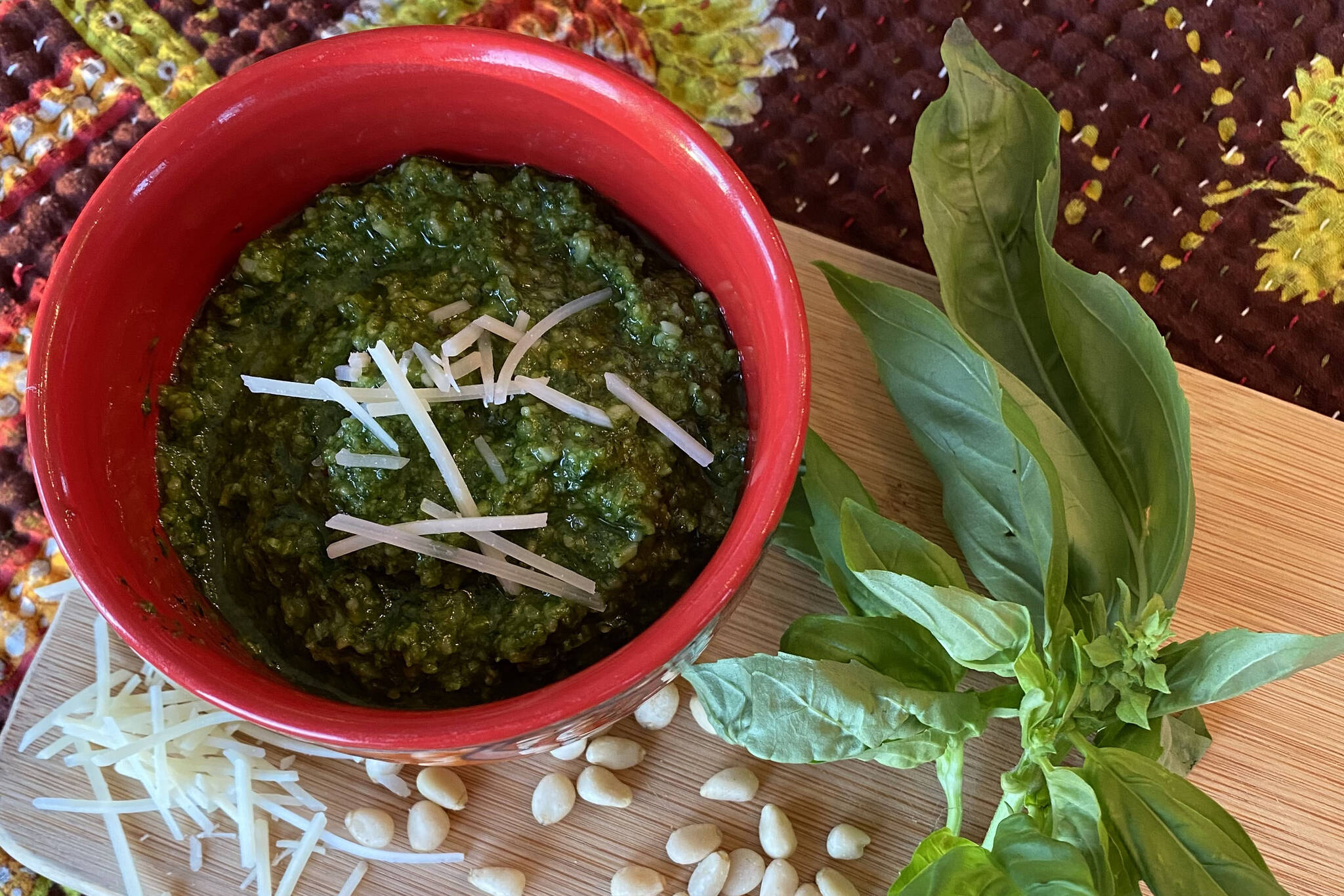 Basil, Parmesan, pine nuts and olive oil come together to make a fragrant pesto. (Photo by Tressa Dale/Peninsula Clarion)