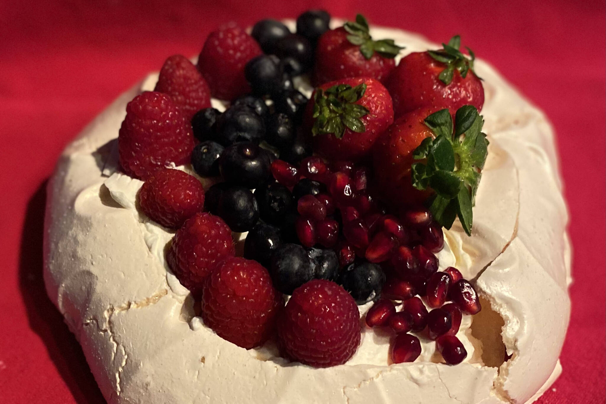 The merigue-based pavlova is a lighter-than-air dessert than can be topped with an assortment of fruits. (Photo by Tressa Dale/Peninsula Clarion)